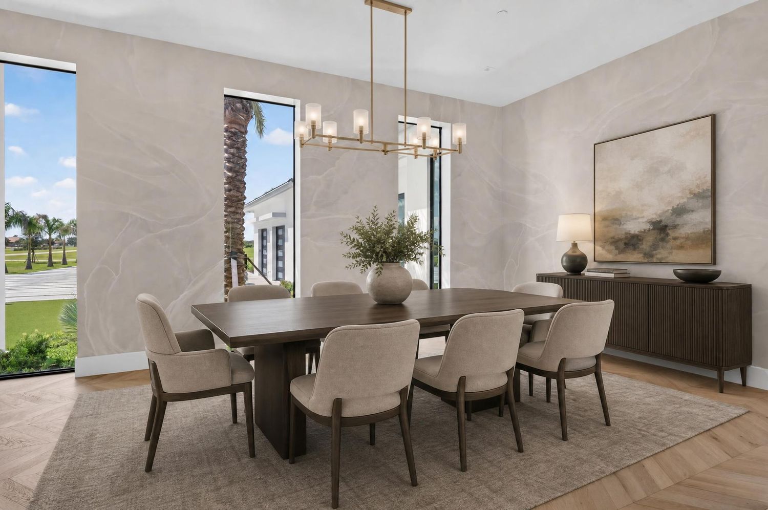 Elegant dining room with rectangular table, upholstered chairs, chandelier, and large windows with garden view.