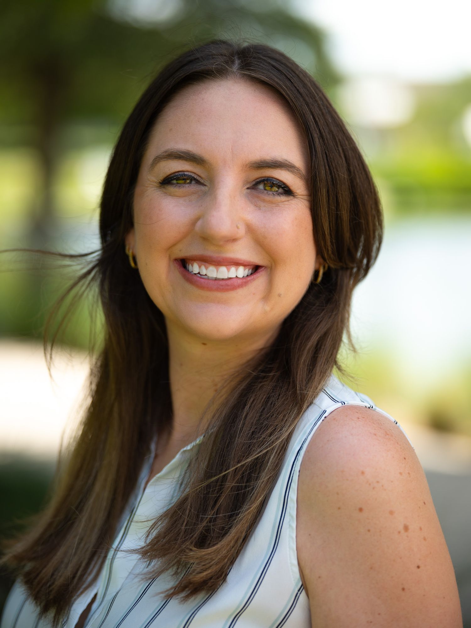 A professional headshot of a woman.