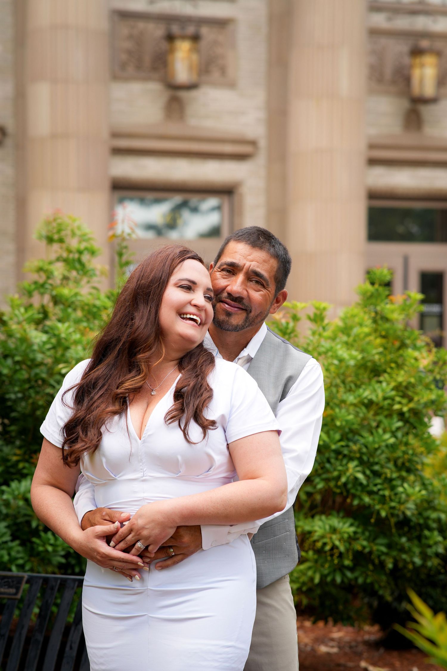 Couple smiling and embracing outdoors during a relaxed couples photography session near Portland, Oregon