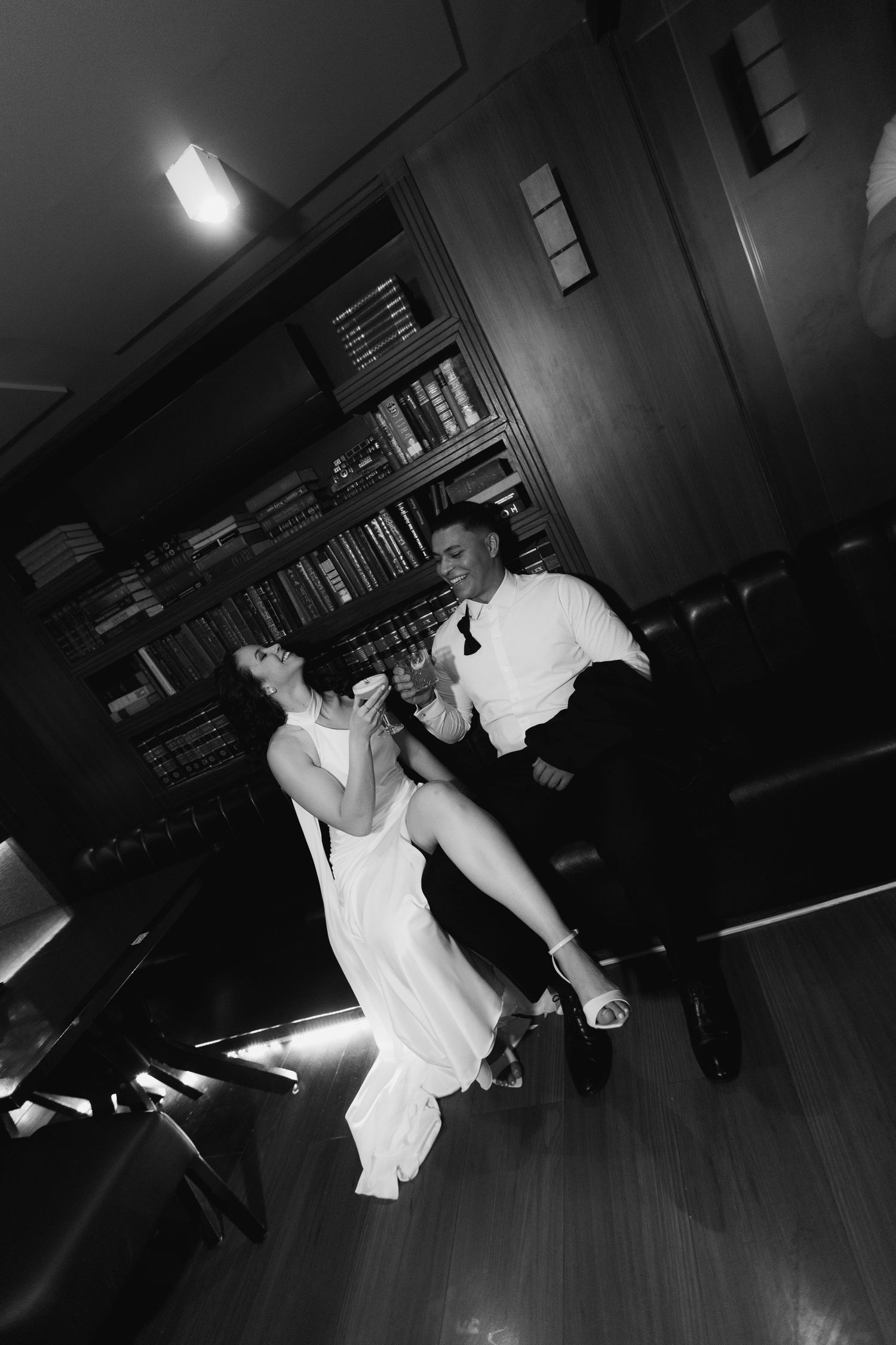 Dynamic black and white dance sequence photos on a wooden floor.