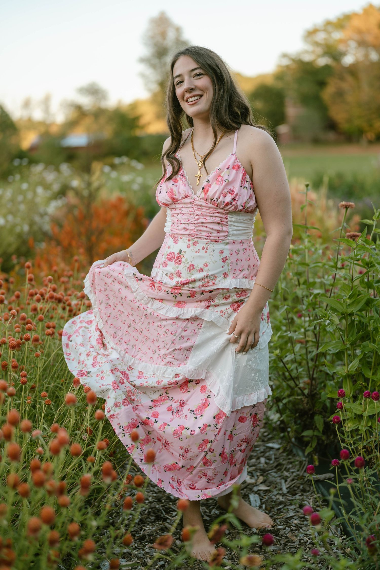 Teen twirling in a colorful meadow, captured in a candid senior session