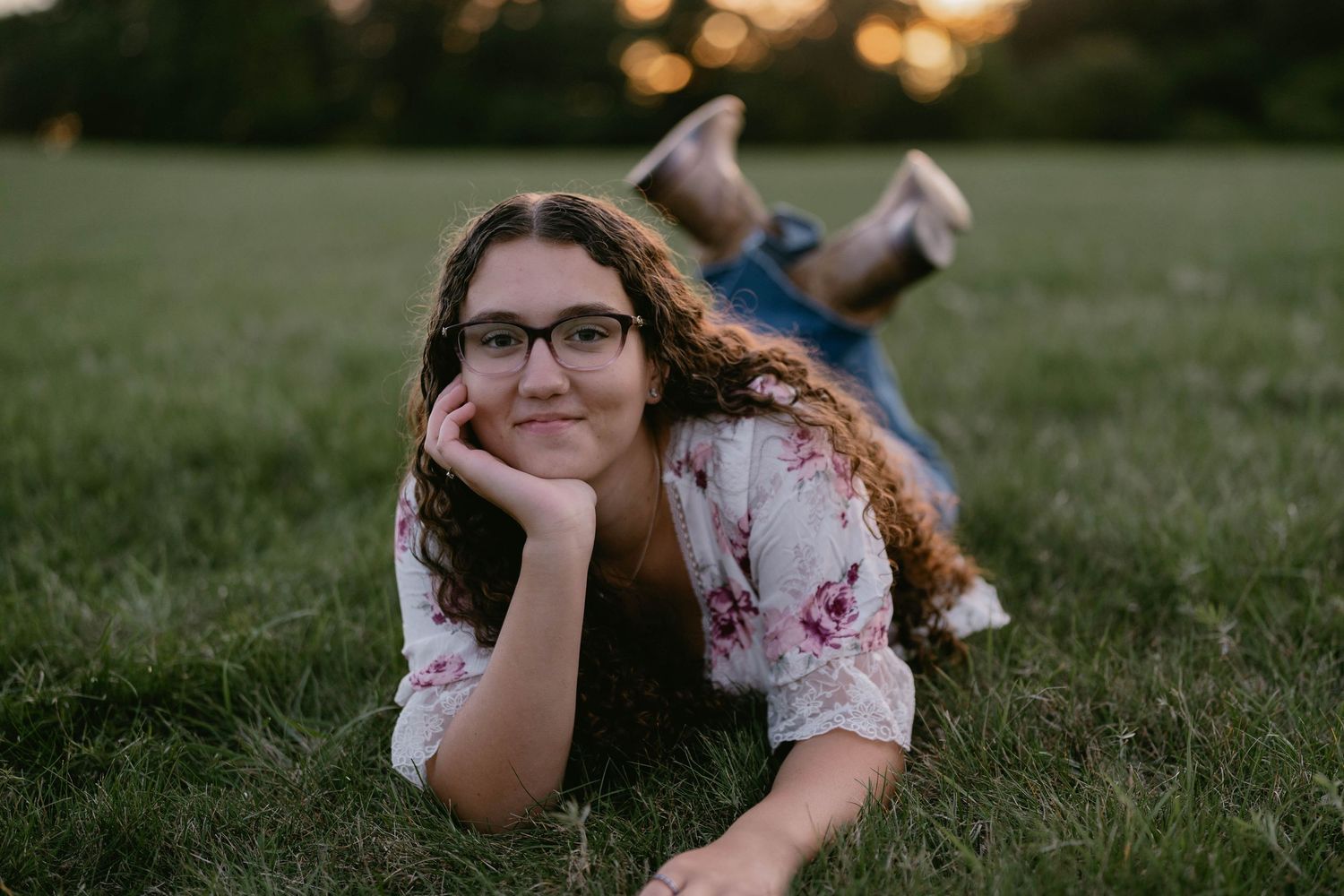 Teen walking through a long grass field, relaxed and captured in golden light.