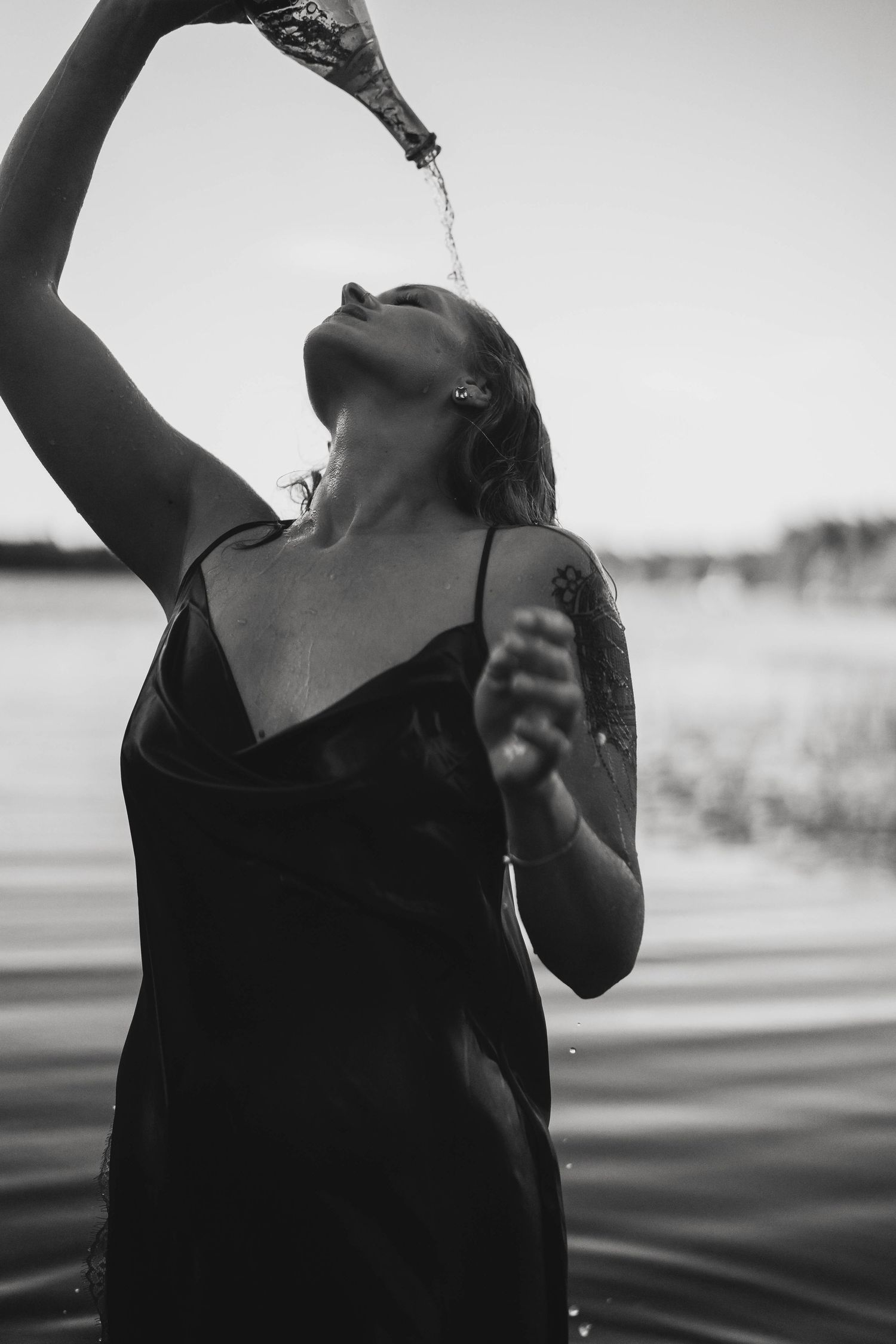 Black and white portrait series showing expressive poses in dramatic lighting.