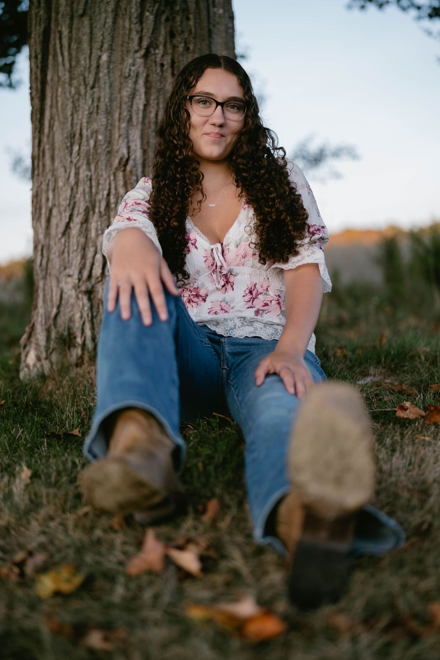 Teen walking through a long grass field, relaxed and captured in golden light.