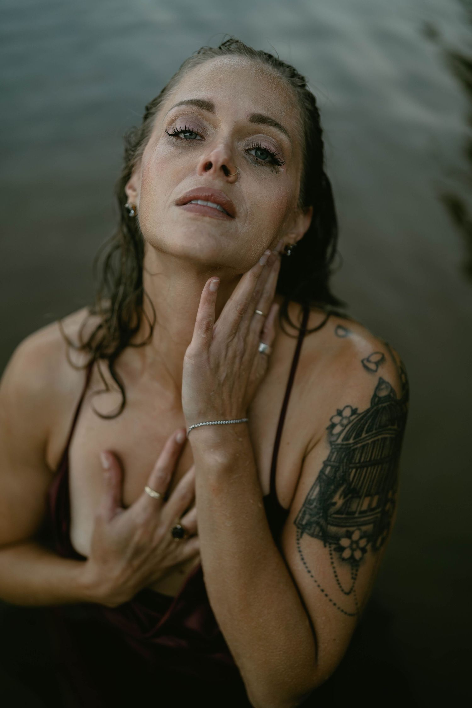Moody close-up portraits captured in dark water with artistic composition.