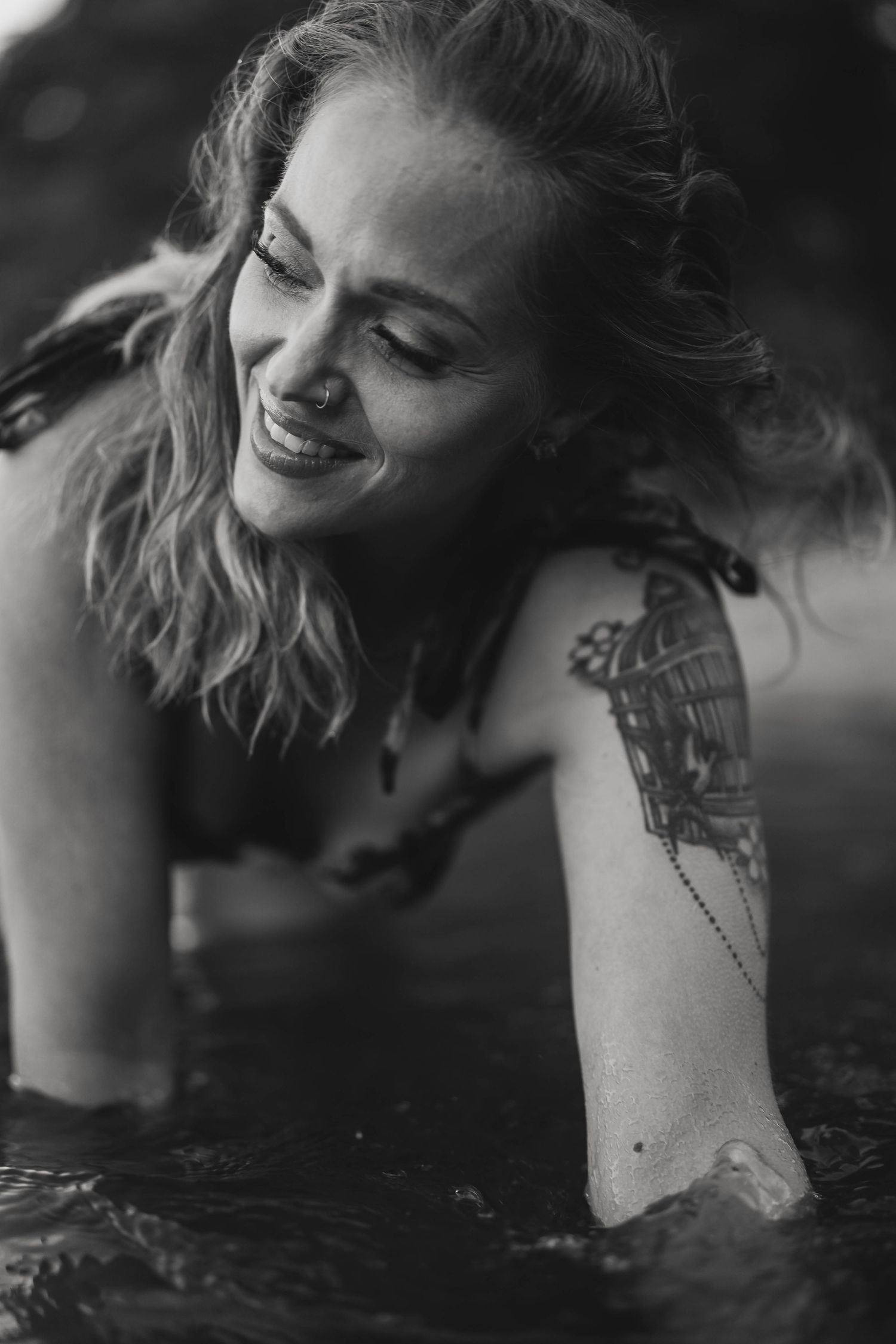 Black and white artistic portraits capturing joyful expressions in water.