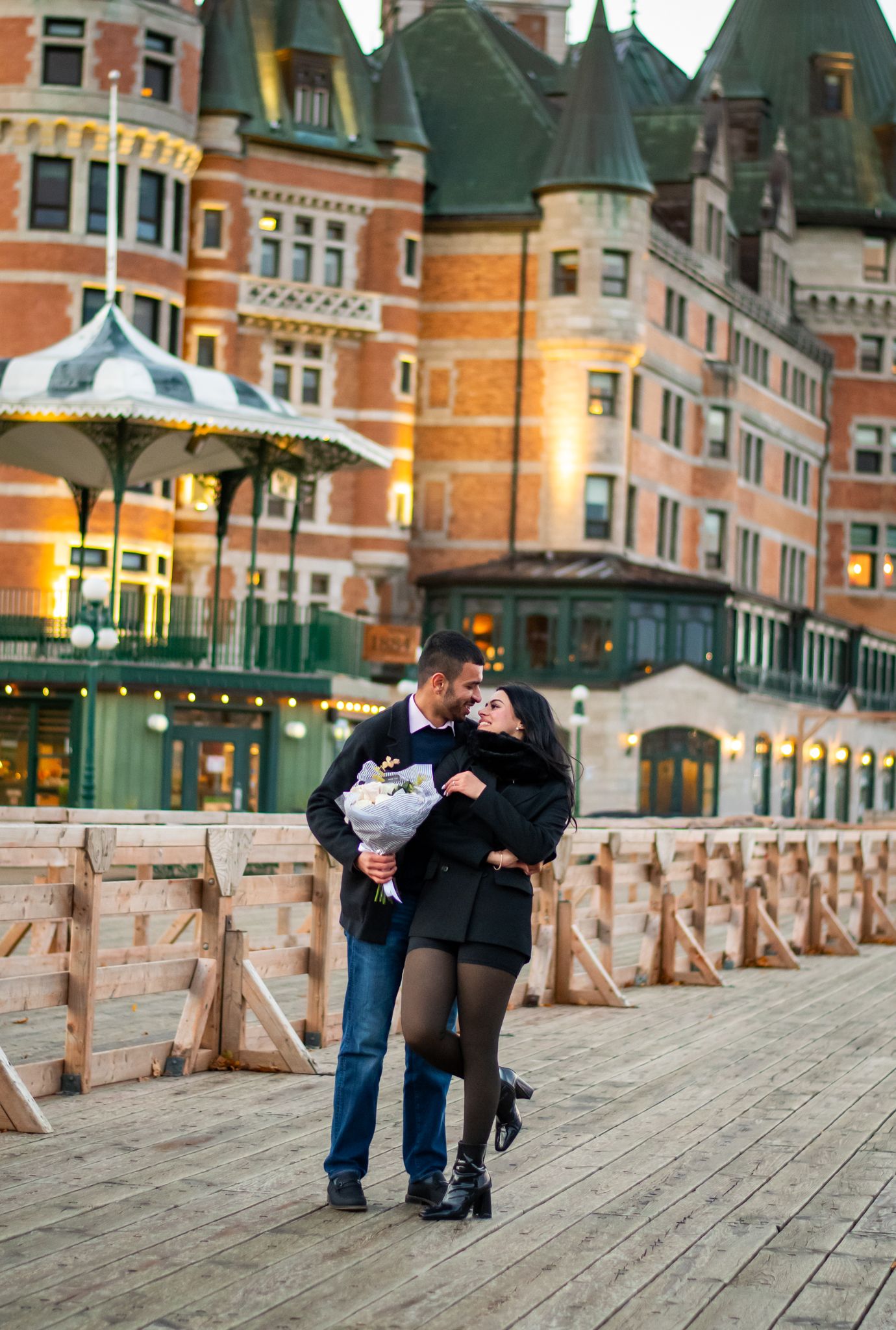 couple in front of Château Frontenac, Terrasse Dufferin, Old Quebec