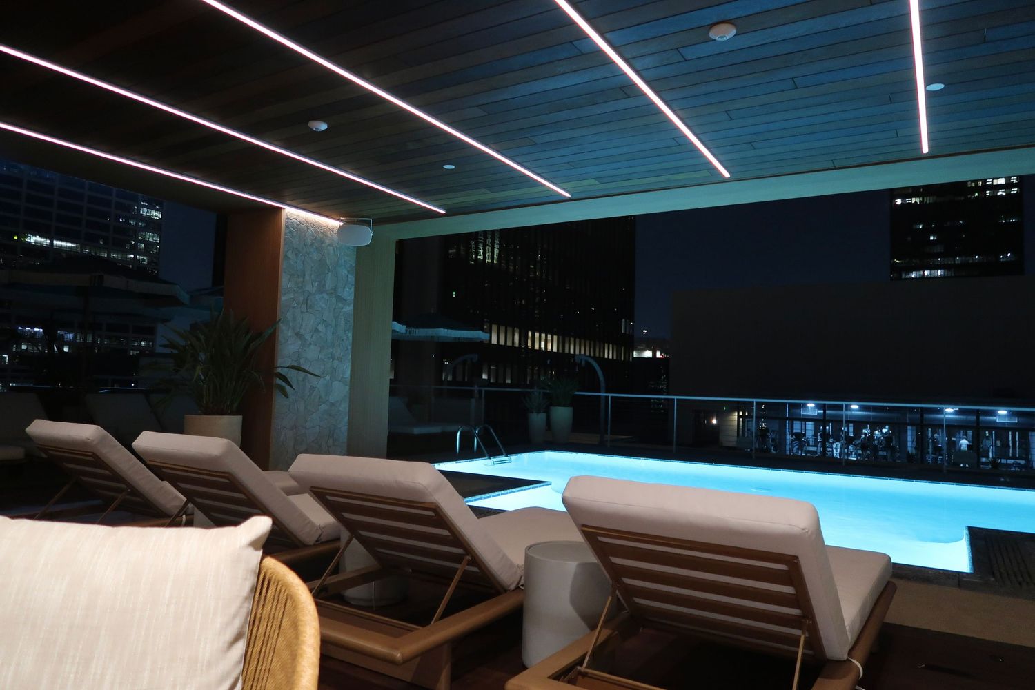 Modern lounge space with sleek lighting and comfortable seating arrangements, los Angeles,  travel photography, rooftop pool, california