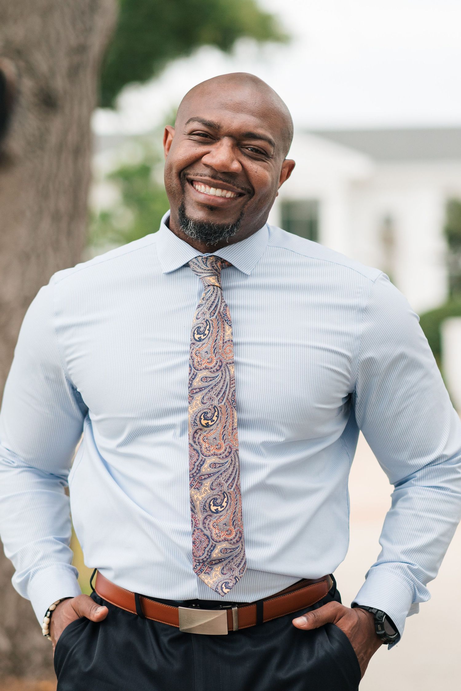 Professional wearing a light blue dress shirt and patterned tie in a series of close-up photos.