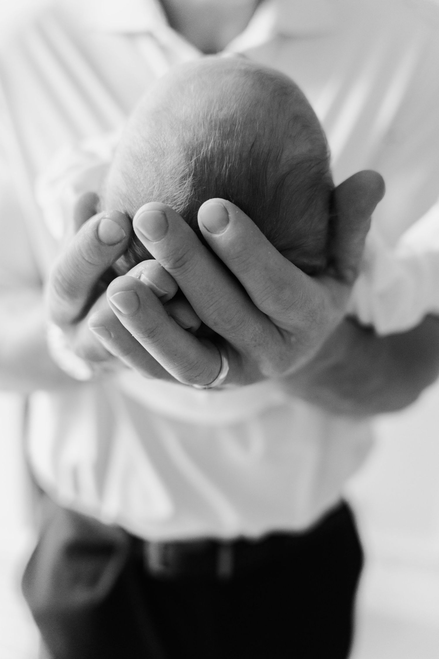 Black and white close-up image sequence showing hands in various positions against a light background.
