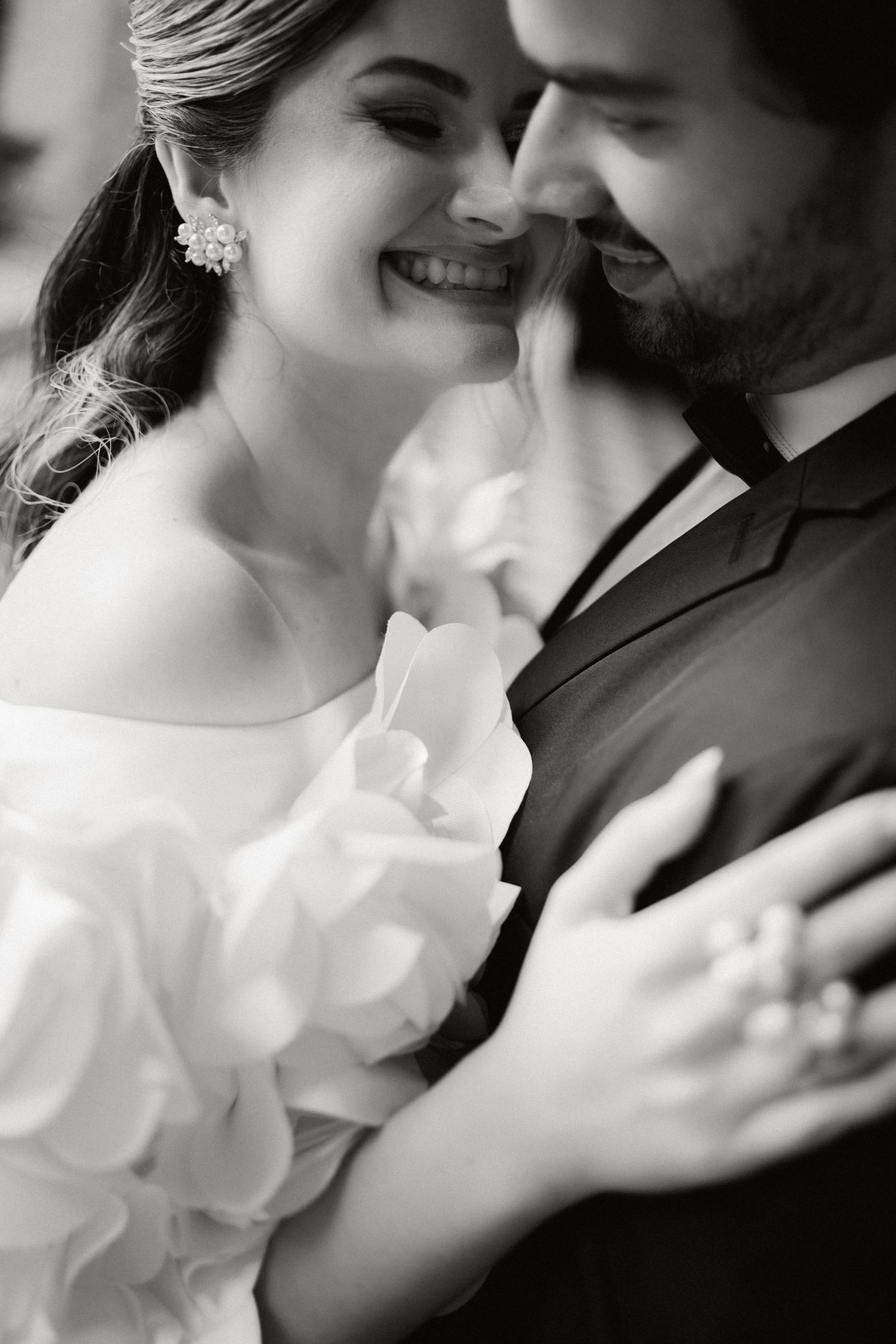 A romantic black and white sequence showing a couple in intimate close-up moments during their wedding celebration.