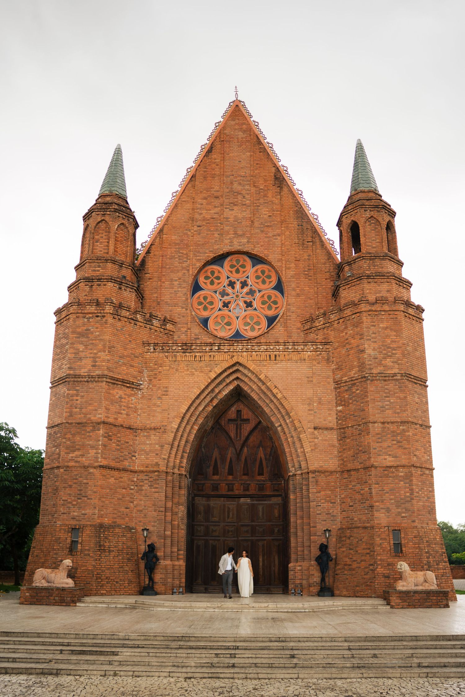 A sequence of photos showing different angles of a Gothic-style red brick church with ornate architectural details and spires.