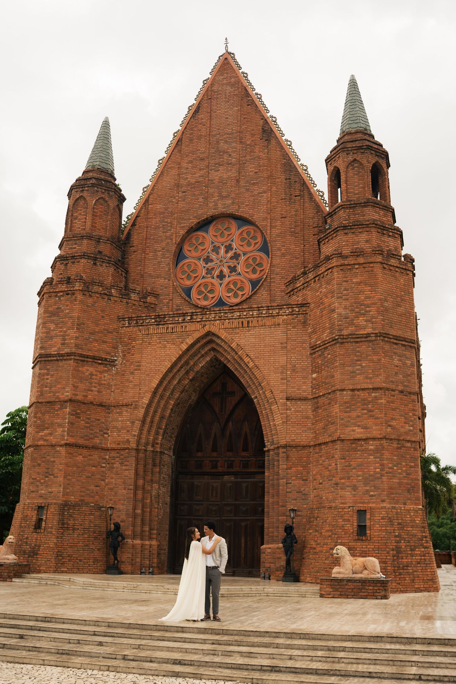 A series of photos showing a red brick Gothic church entrance with arched doorways from different angles during a wedding.