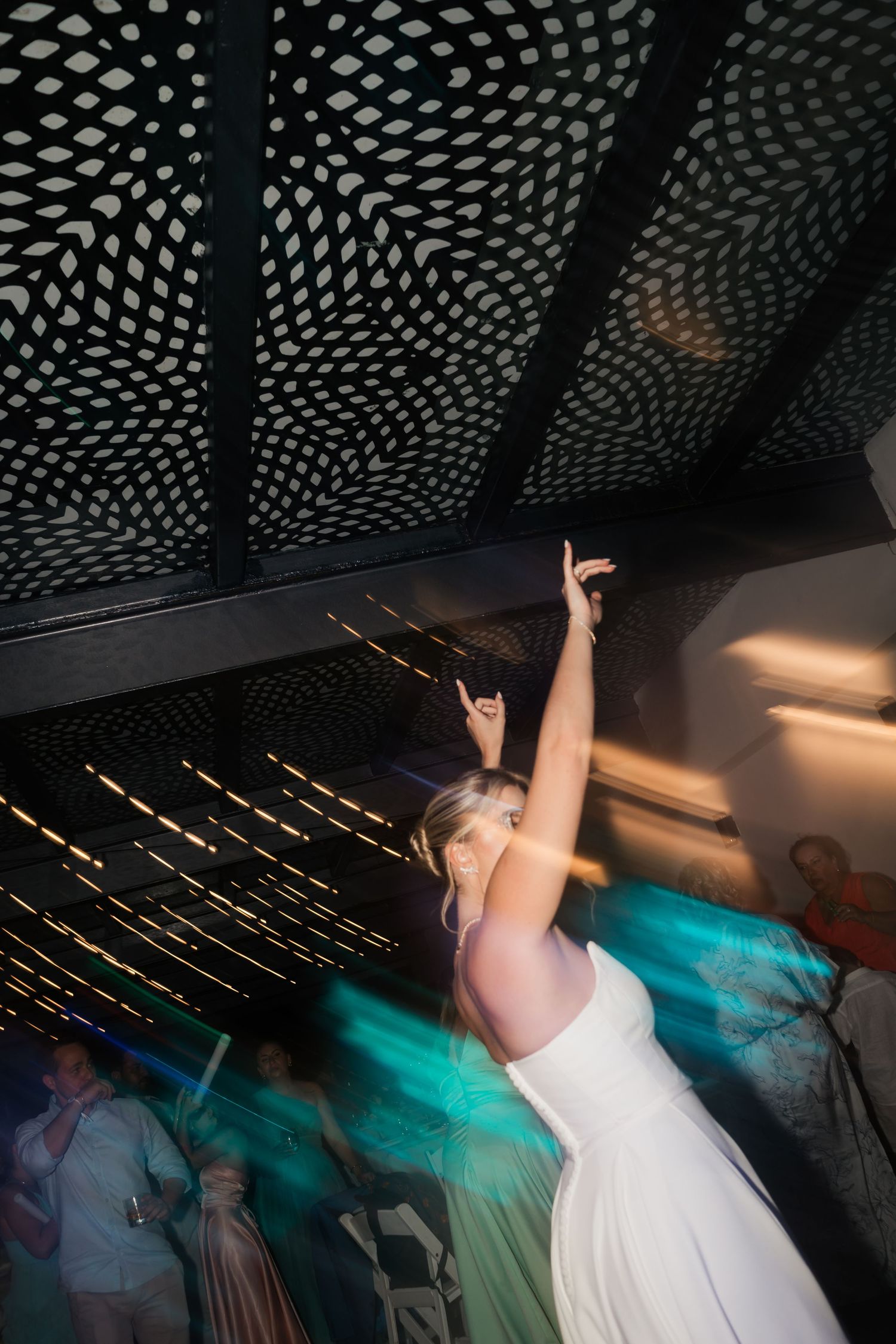 Wedding reception venue with decorative dotted lighting pattern on ceiling creating a magical atmosphere.