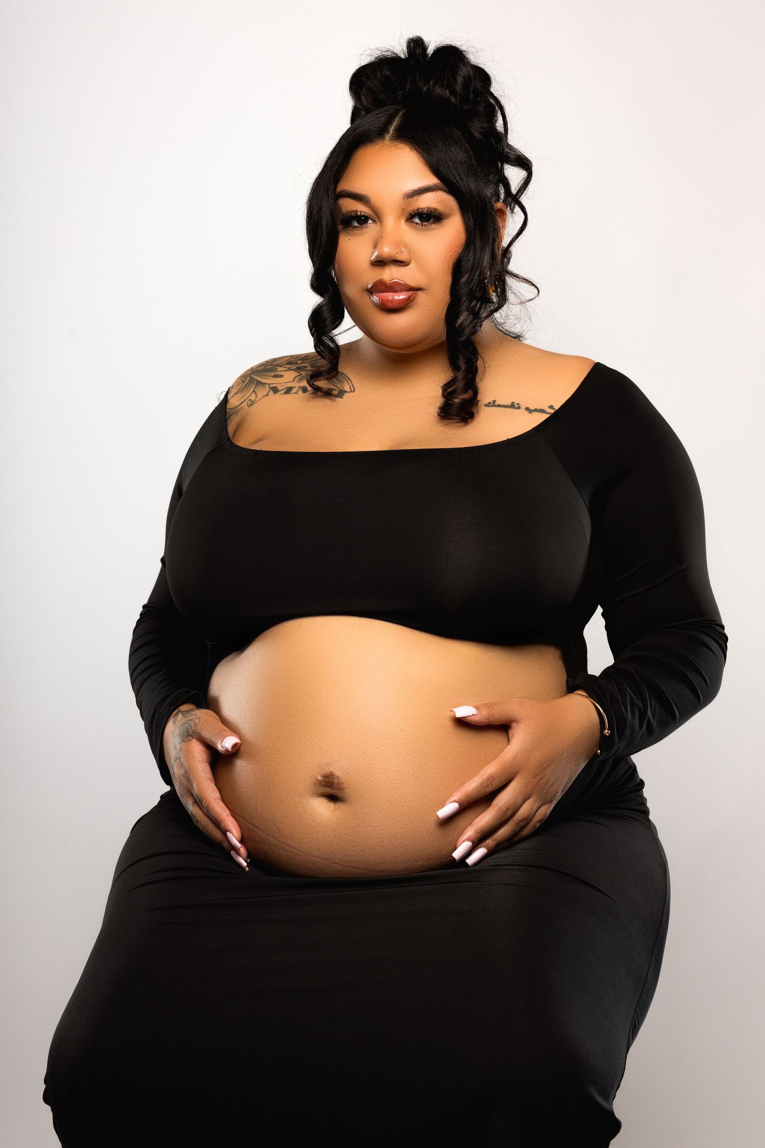 A series of photos showing a person in black clothing posing against a white background while displaying their midriff.