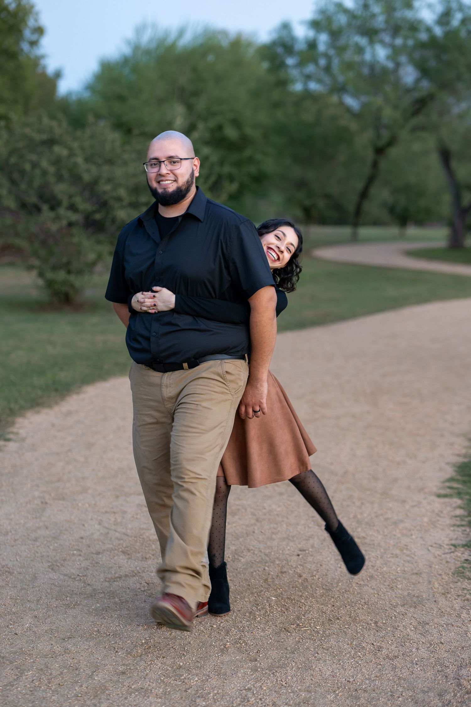 A sequence of playful poses captured on a dirt path with trees in the background.
