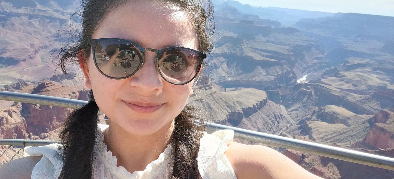 Scenic selfie overlooking the majestic red rock canyons and valleys of the Grand Canyon.