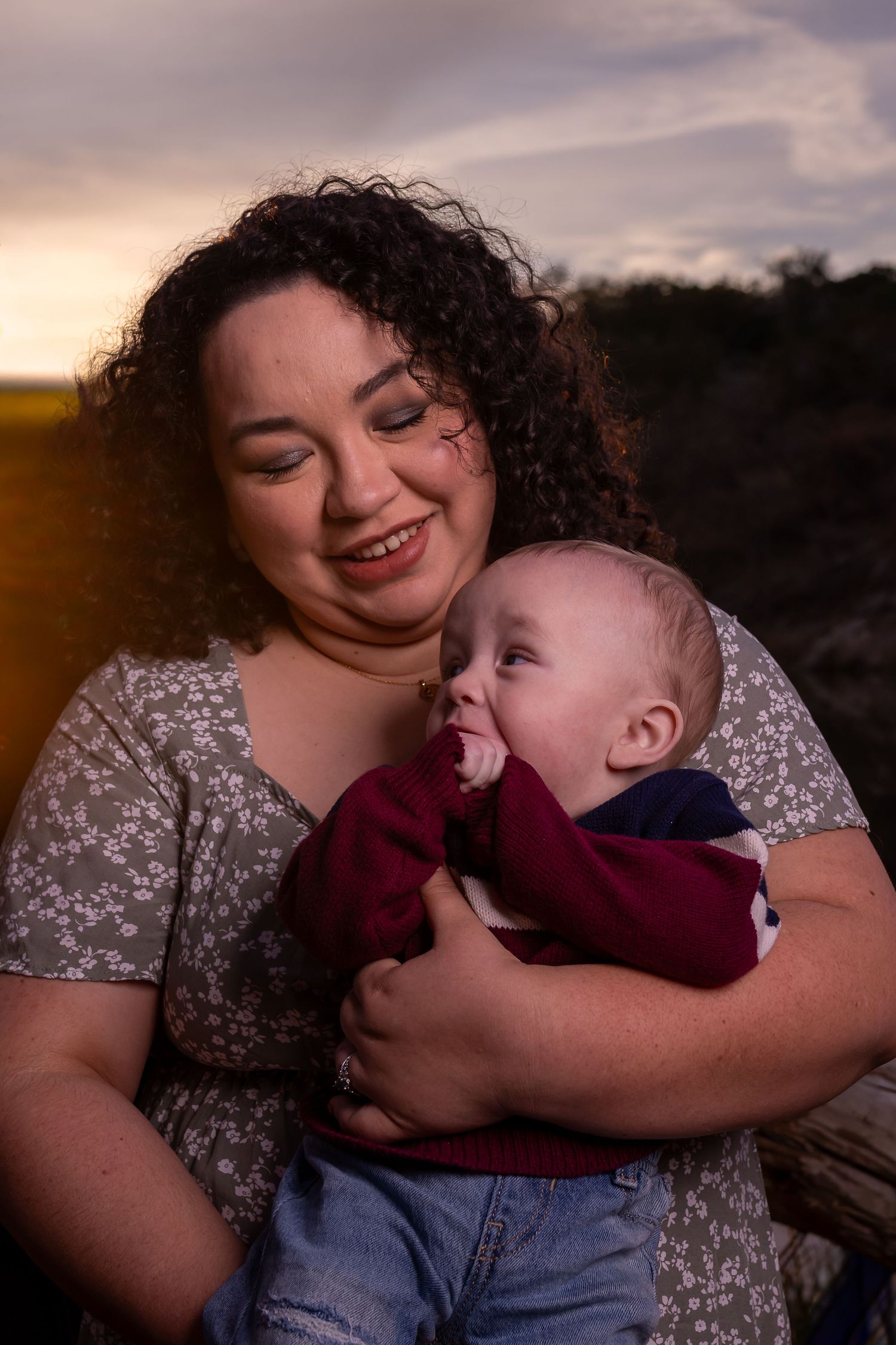 Intimate family portrait series showing joyful interactions between parent and child at dusk.