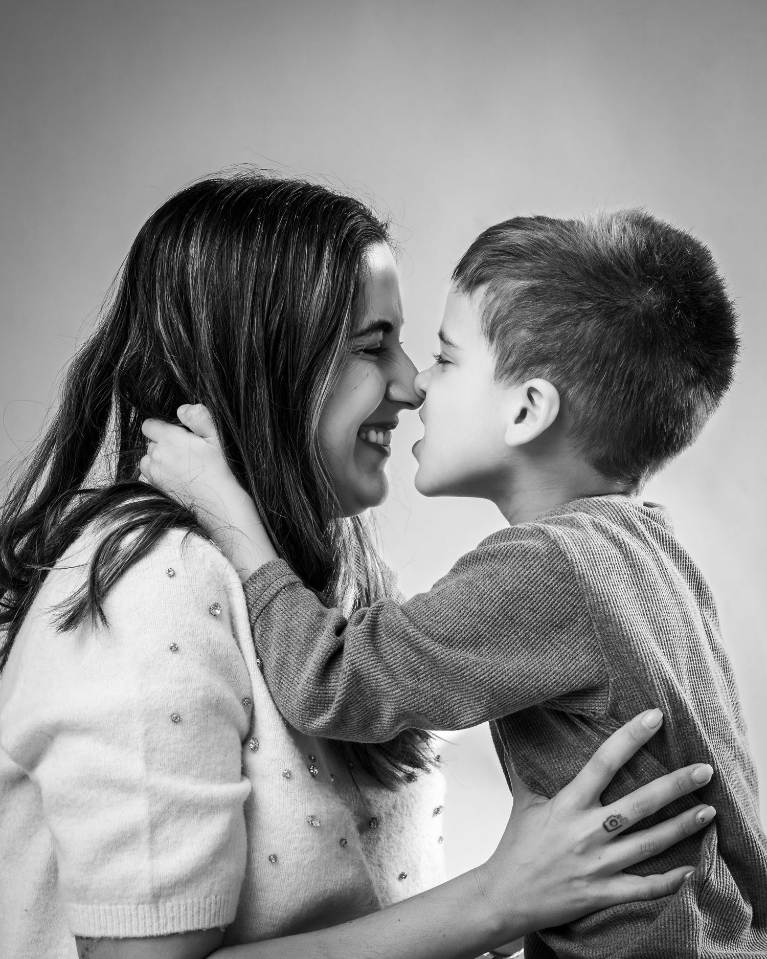 A romantic black and white photo sequence showing a couple embracing and sharing intimate moments together.