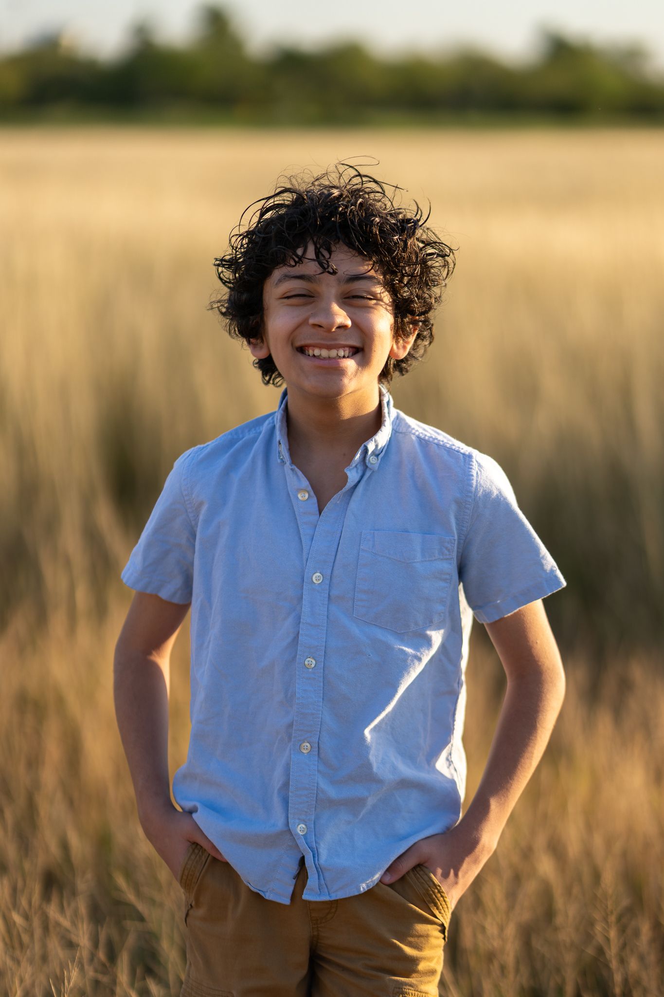 Candid portraits in a sun-drenched wheat field.
