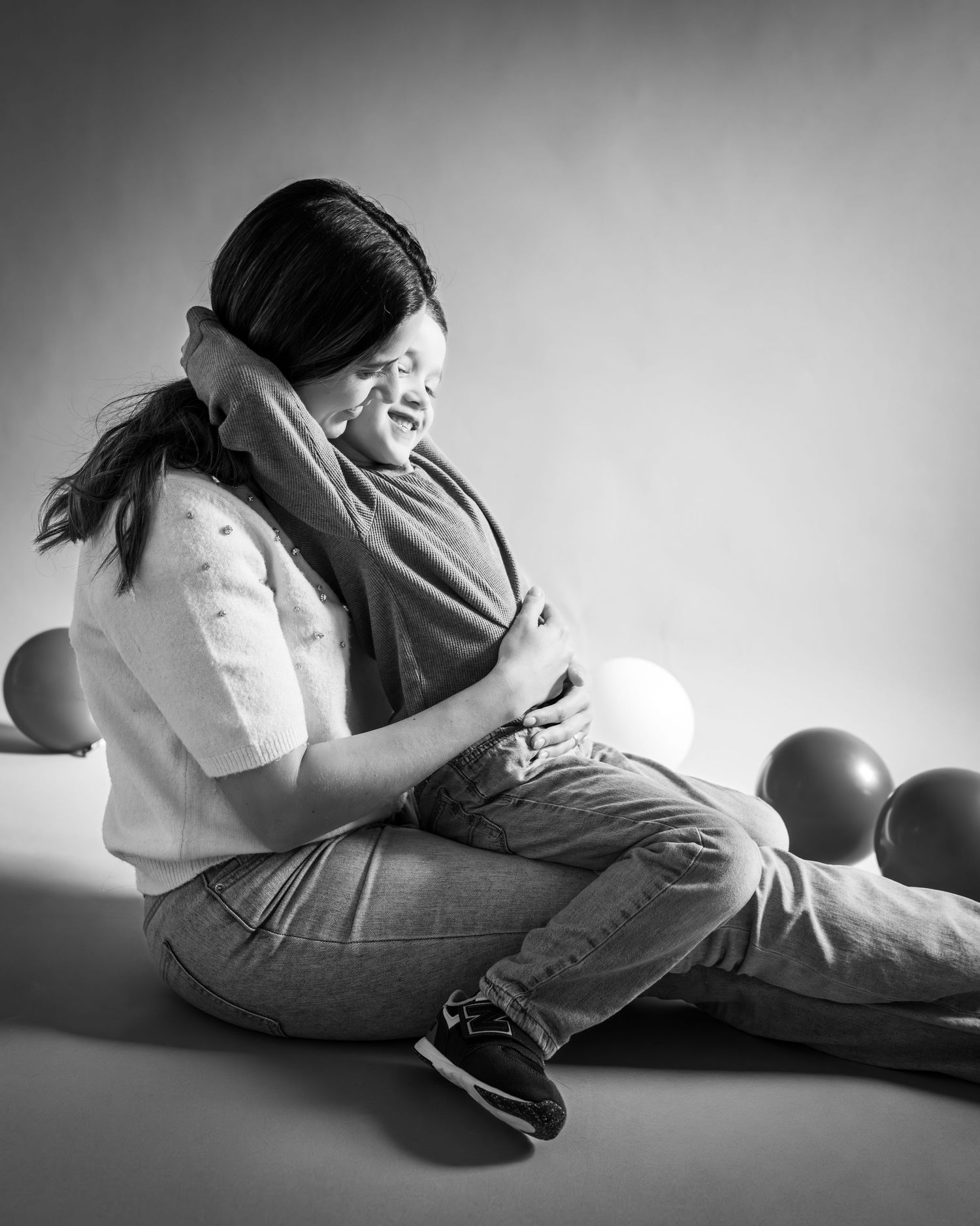 Black and white photo series showing someone lying on the floor in different resting positions.