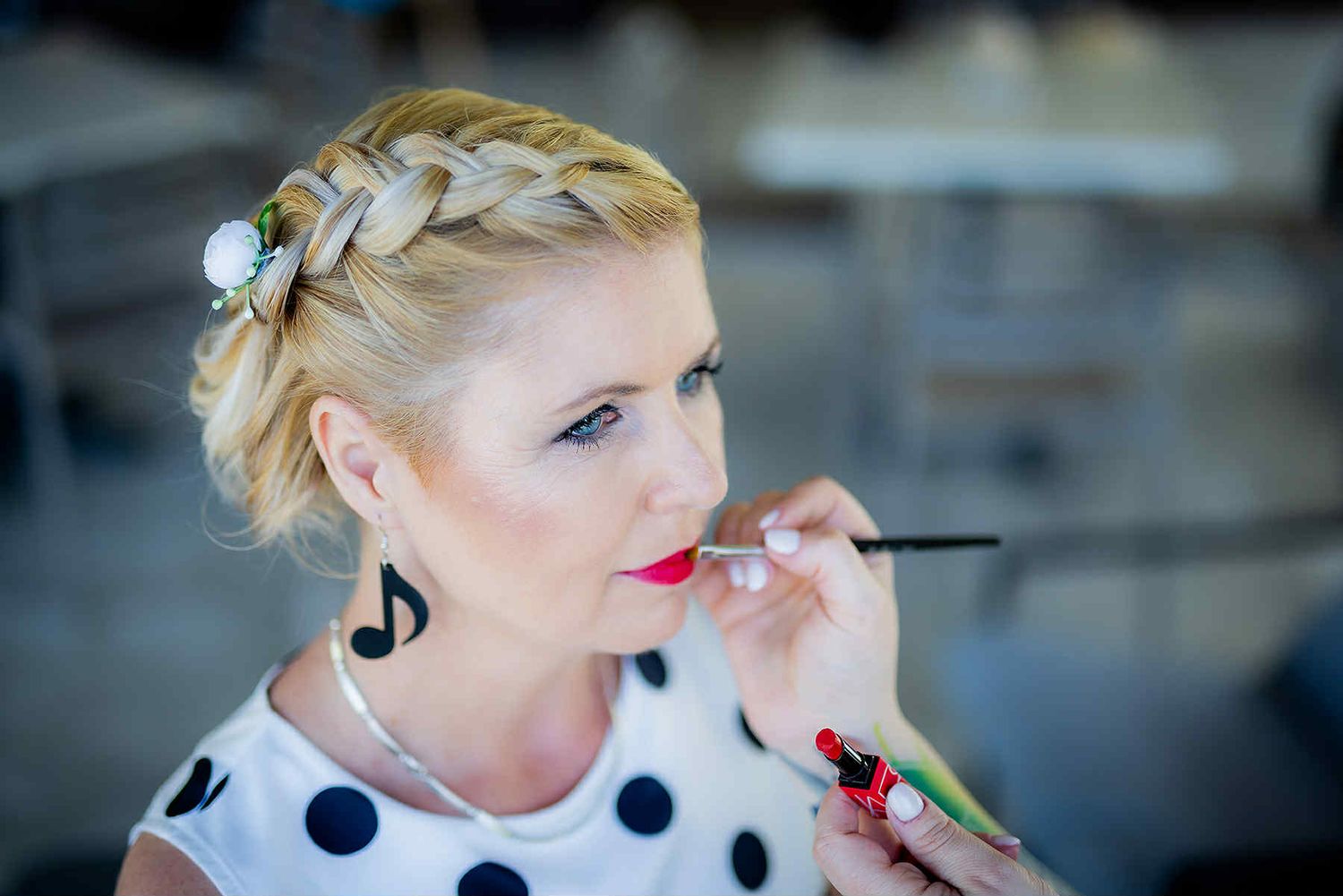A sequence showing vintage-inspired retro styling with polka dots and bold red lipstick in profile views.