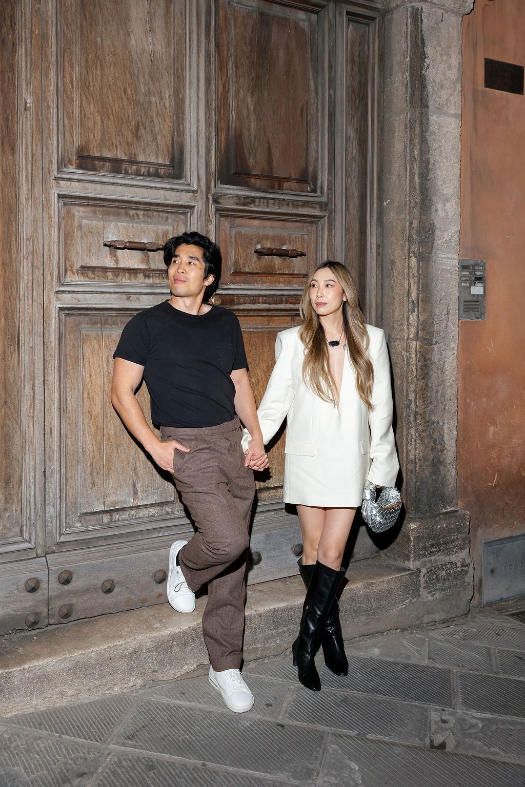 A series of motion shots showing two people dancing and moving against an old building's exterior wall.