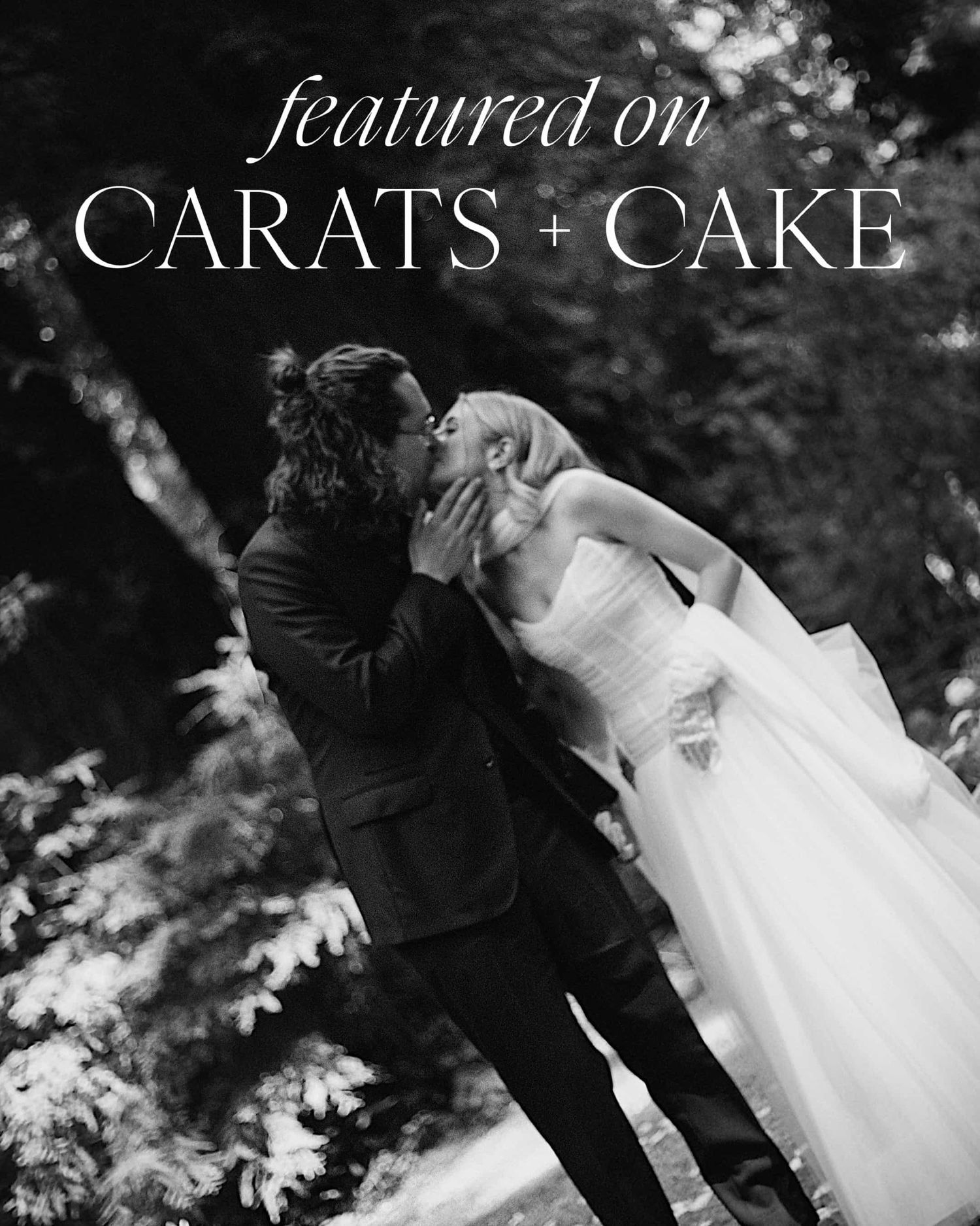 Black and white wedding photo captured by Eden Xuân Photo with couple embracing outdoors, featuring Carats + Cake text overlay.