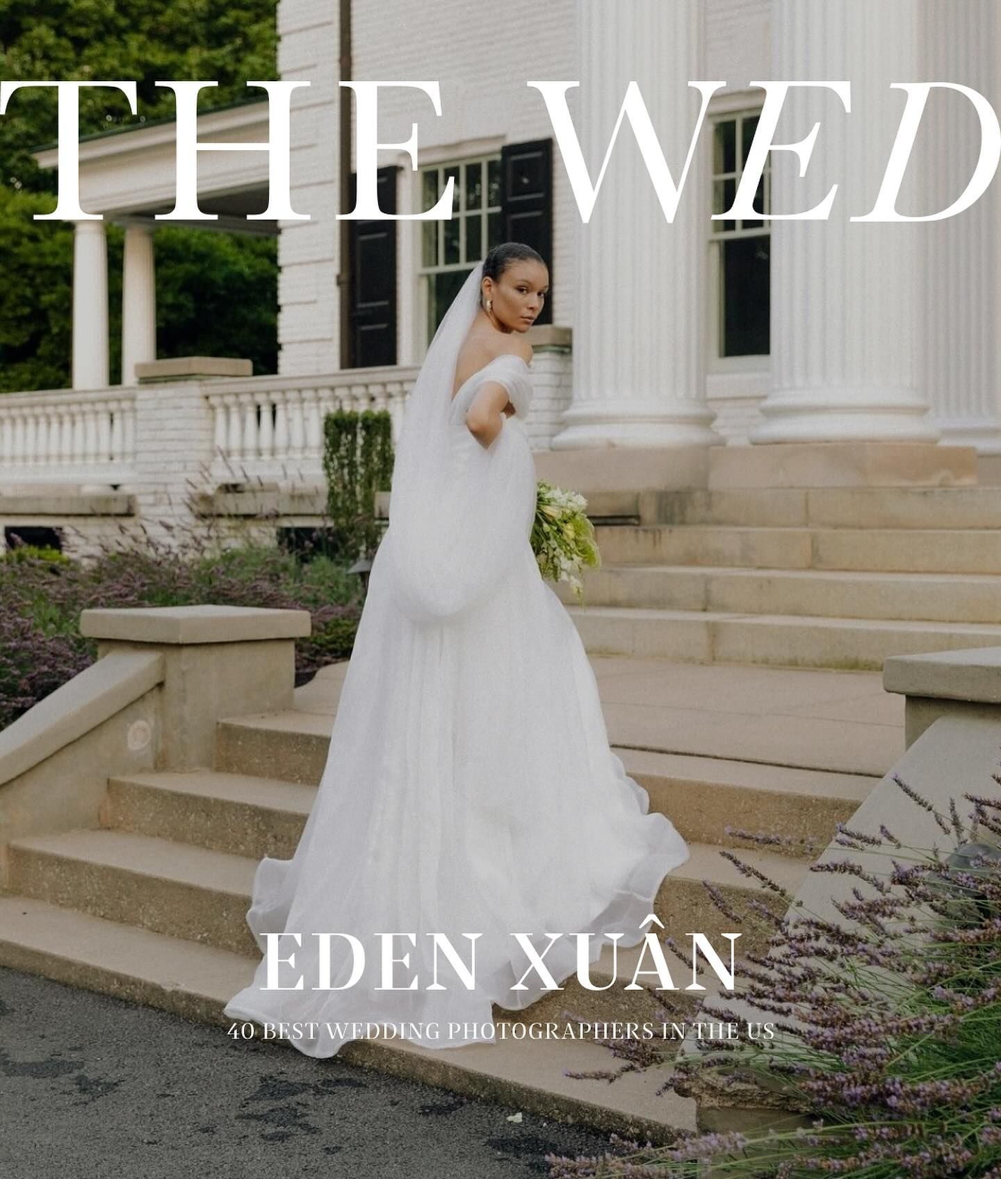 A bride in a flowing white gown stands elegantly on stone steps near classic white columns for a bridal magazine cover.