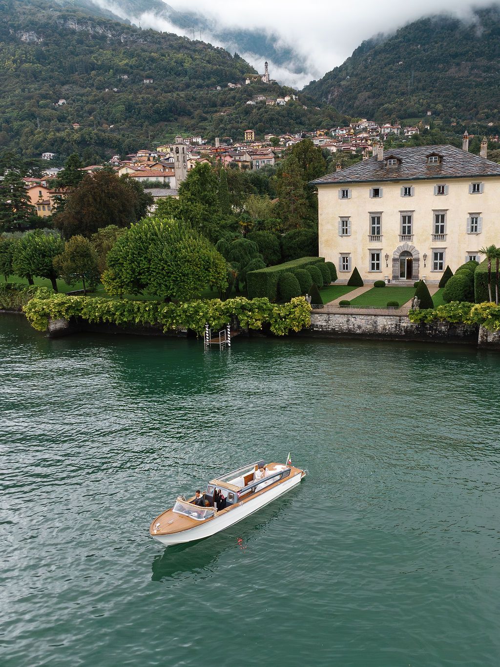 A series of scenic photos showing boats on Lake Como with mountainous landscapes and lakeside villas in Italy.