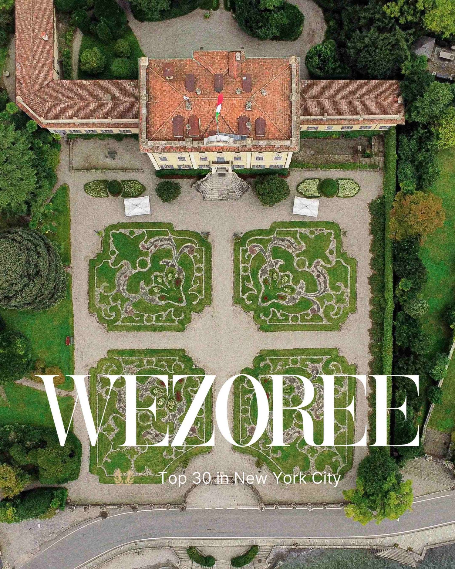 Aerial view of symmetrical ornate formal gardens with manicured hedges and geometric patterns at a historic estate in in Lake Como.
