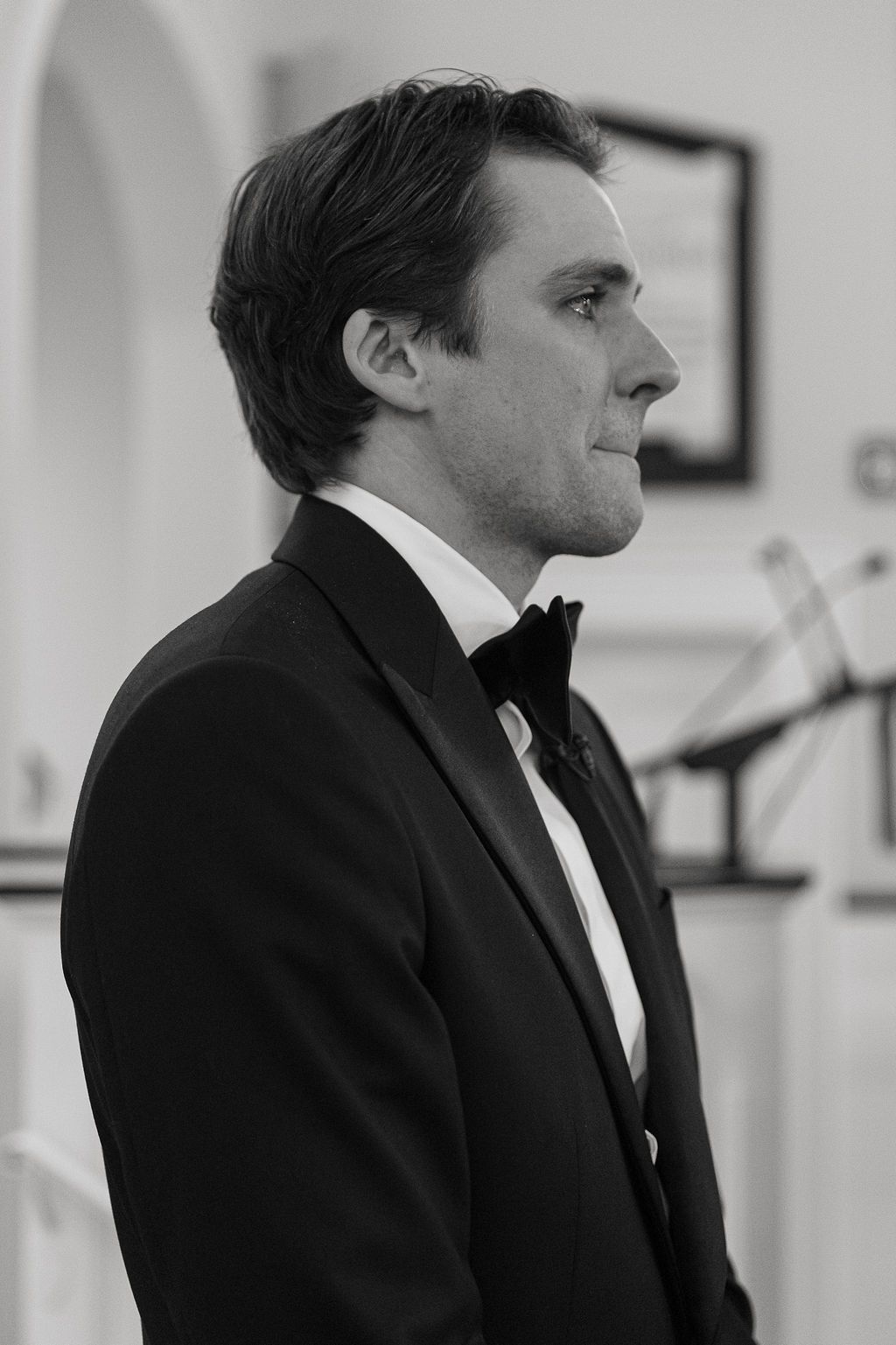 Close-up profile views of a musician in a black suit and bow tie.