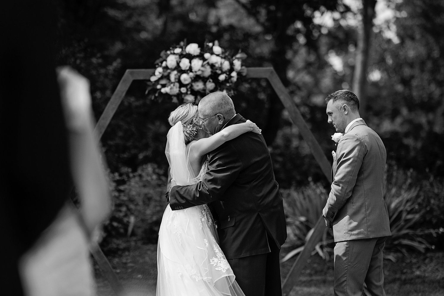Black and white sequence of emotional wedding ceremony moments outdoors.