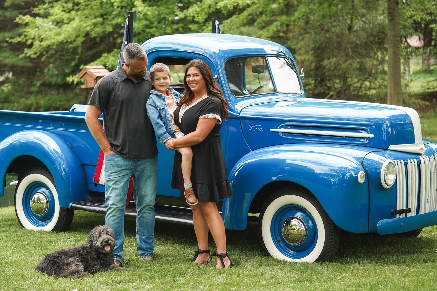 A series of photos showing a classic blue vintage car at a casual outdoor car show gathering.