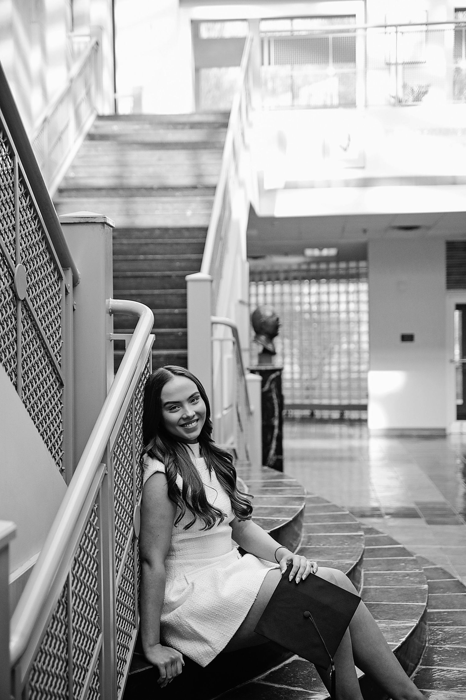 A black and white photo series showing a person posing casually against a wall in an urban setting.