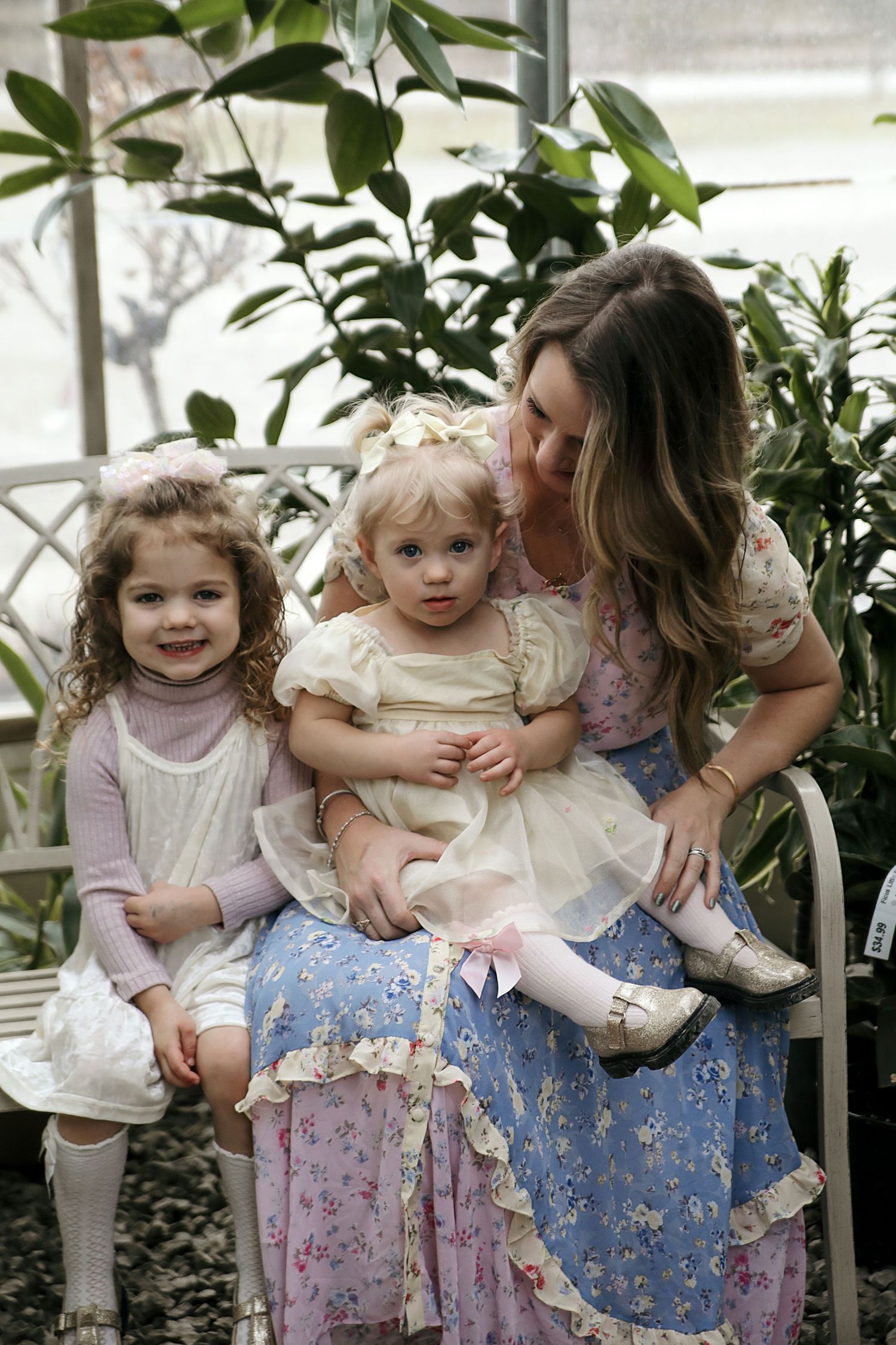 A series of three candid family photos showing tender moments between loved ones among green plants by a window.
