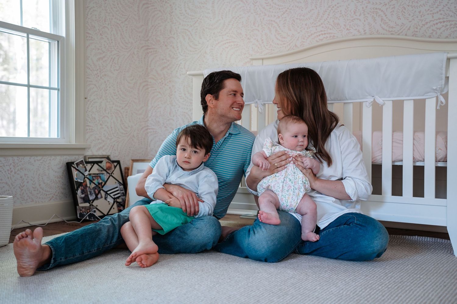 A series of connected photos showing a family lying together on a floor in progression while snuggling and bonding.