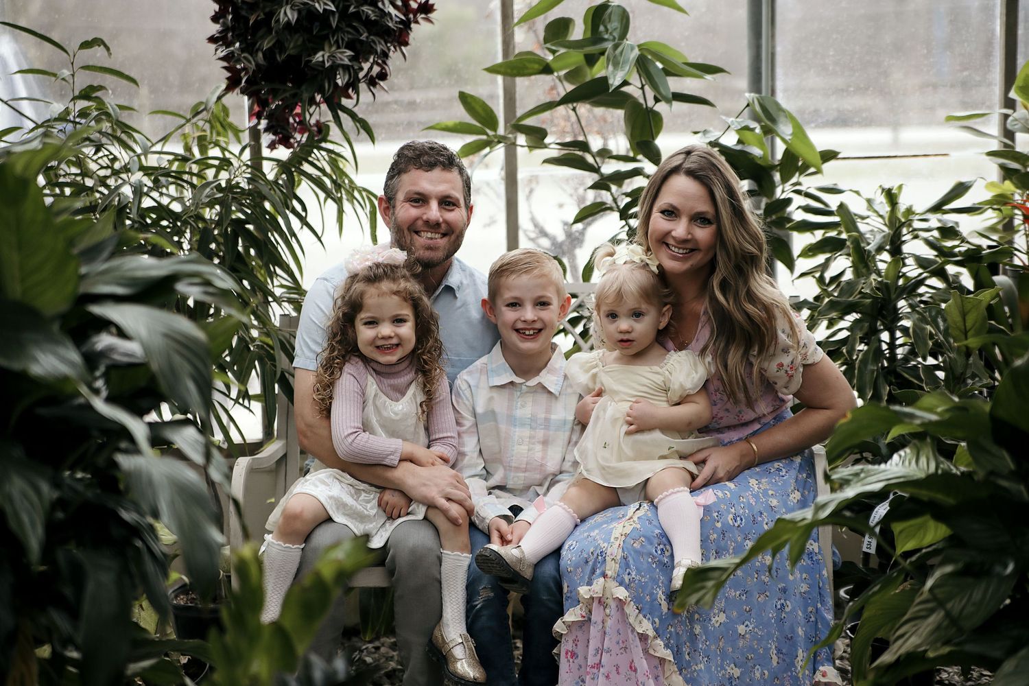 A collage of candid outdoor family portraits taken in a garden setting with lush greenery and natural lighting.