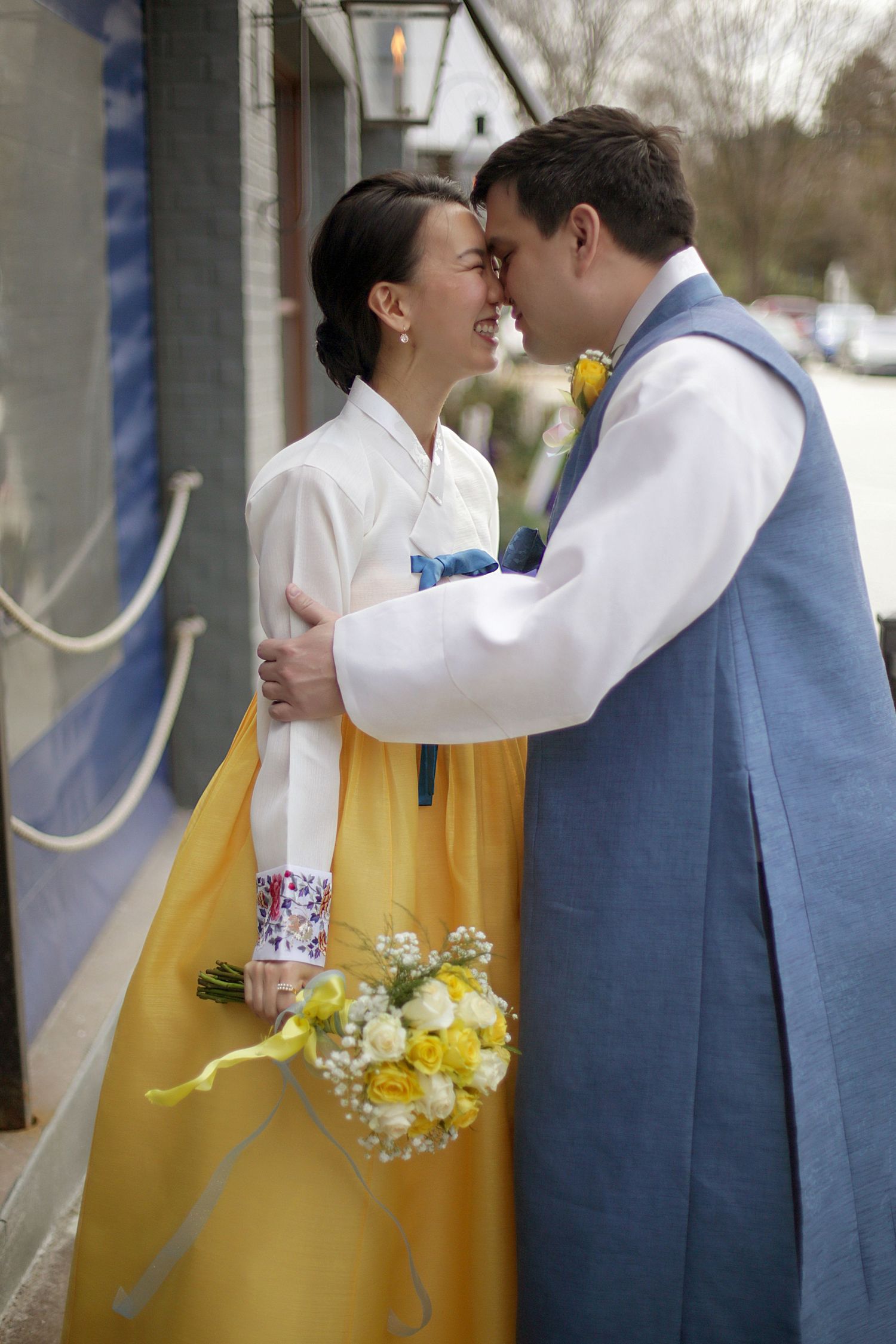 A couple in traditional Korean hanbok attire share intimate moments in a sequence of romantic poses.