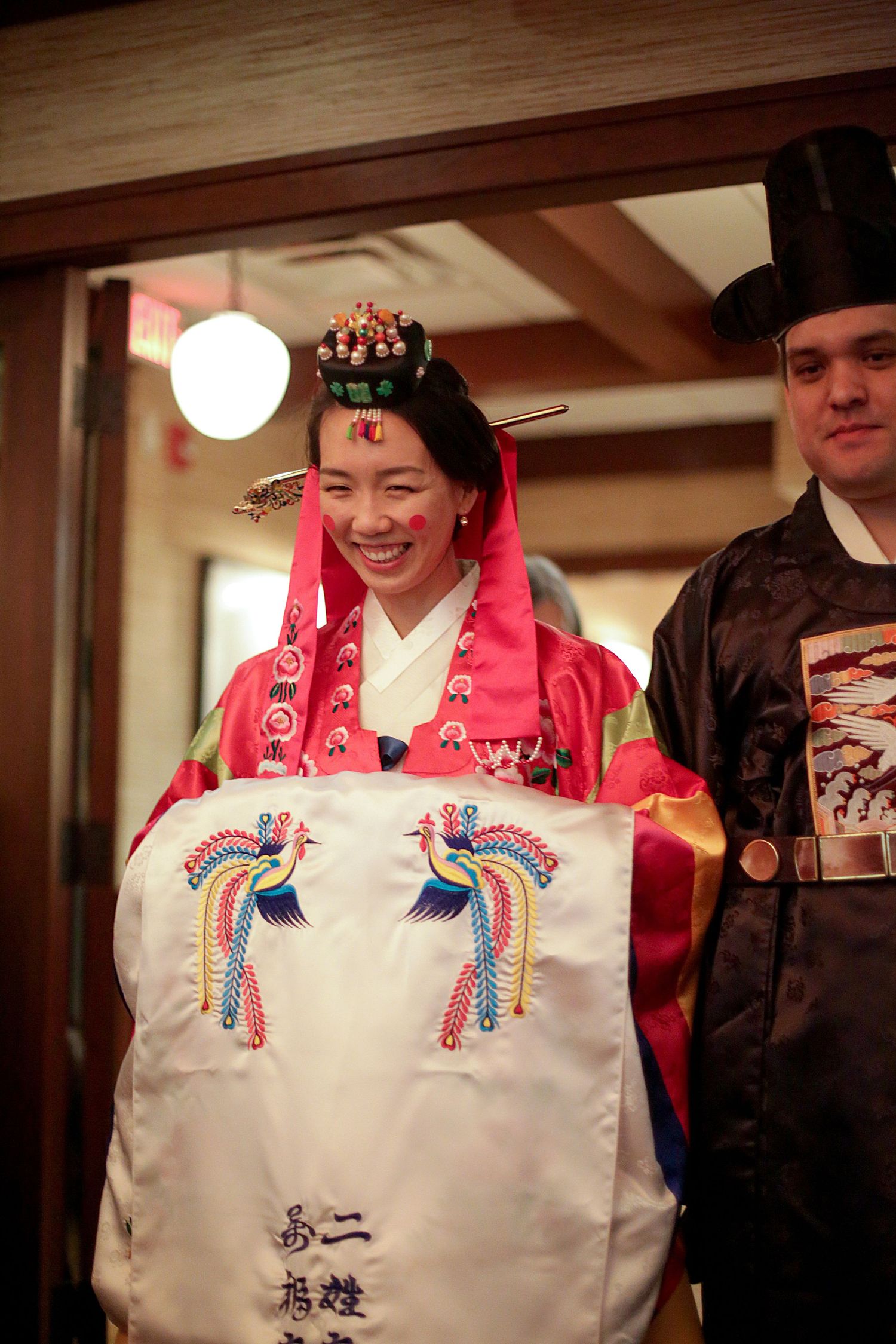 Traditional embroidered Japanese wedding kimono details shown in a sequence of close-up photos in warm lighting.