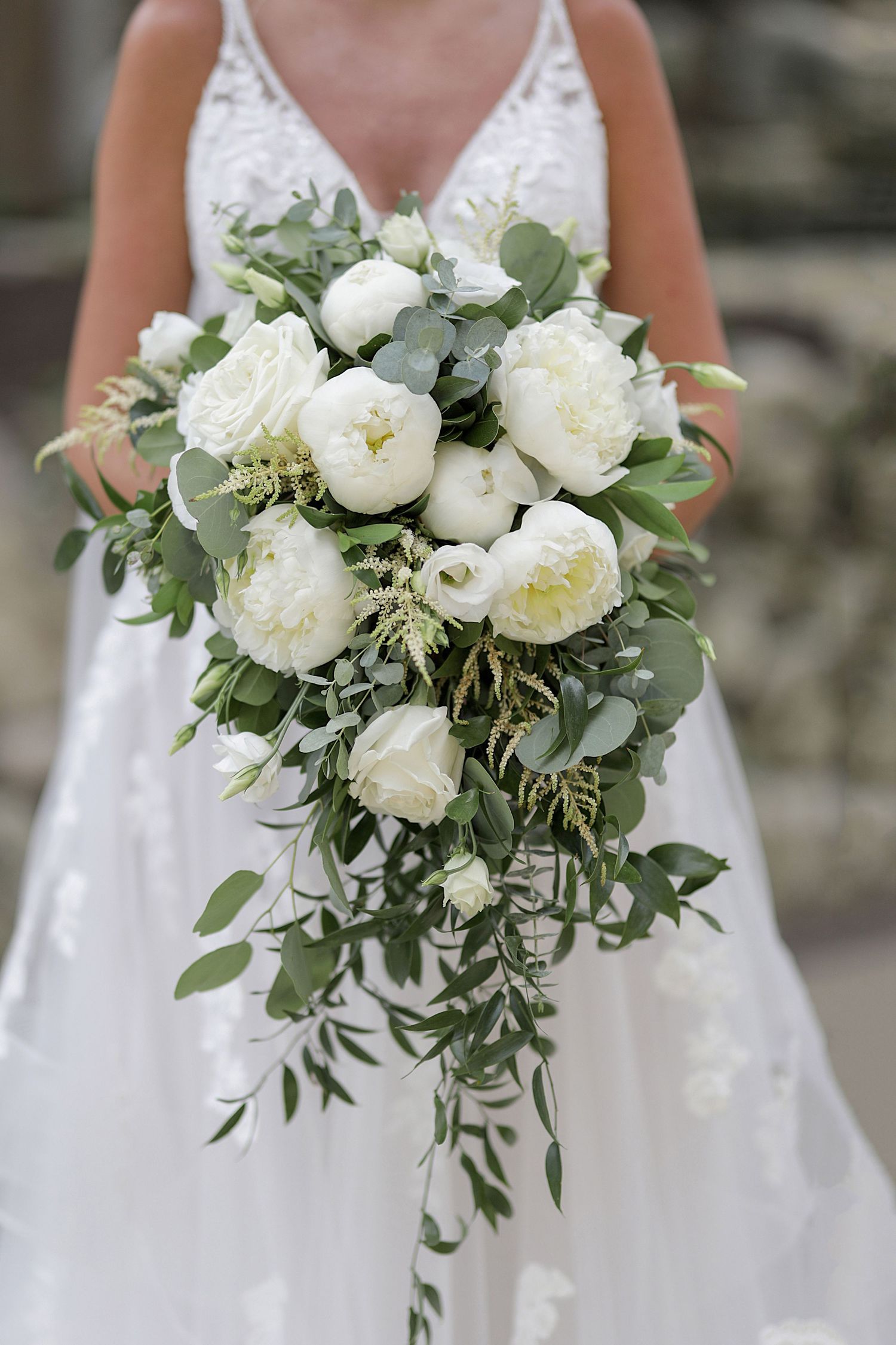 White peony and eucalyptus bridal bouquet shown in progressive detail shots.