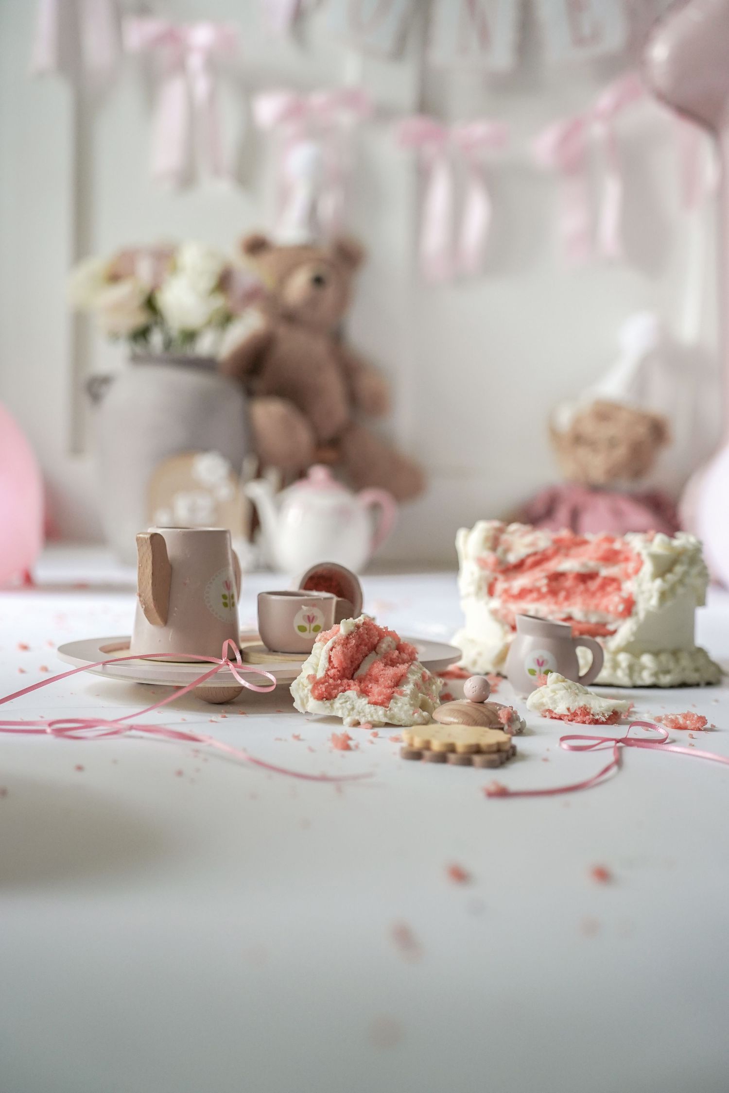A soft aesthetic montage of pink and beige cookies and stuffed animals on a white surface with vintage decor styling.