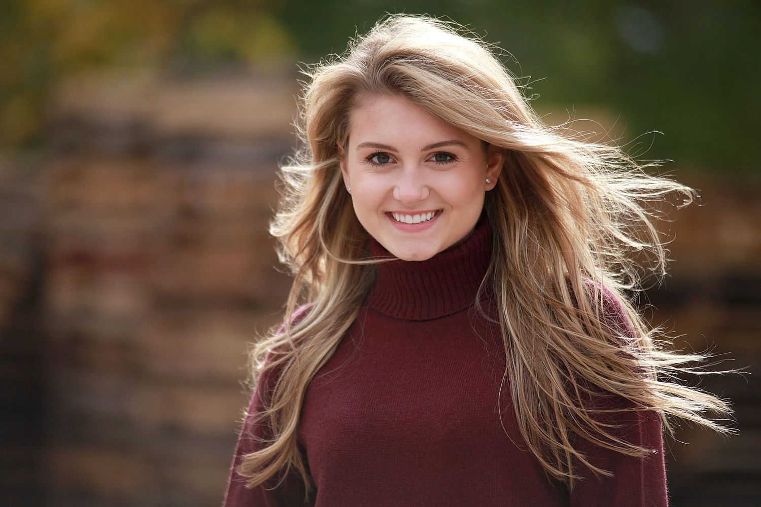 Outdoor portrait series with burgundy sweater against natural fall background. Senior Photography Chagrin Falls Ohio