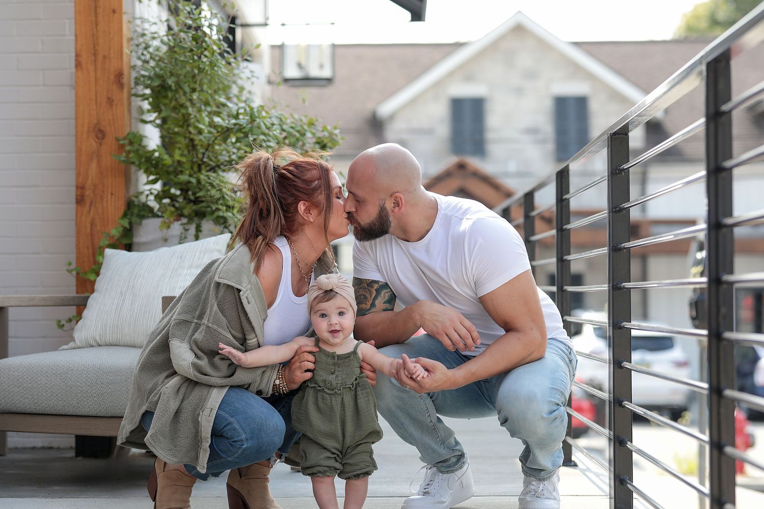Family sharing intimate moment together on outdoor patio.  Family Photography in Chagrin Falls Ohio