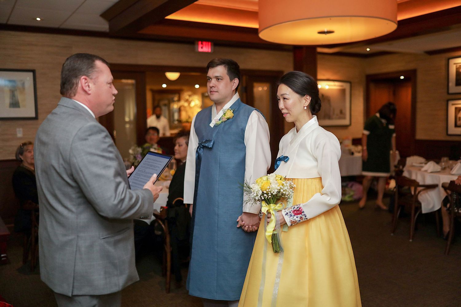 Four sequential wedding reception photos show a couple and another guest interacting in a warmly lit indoor venue.
