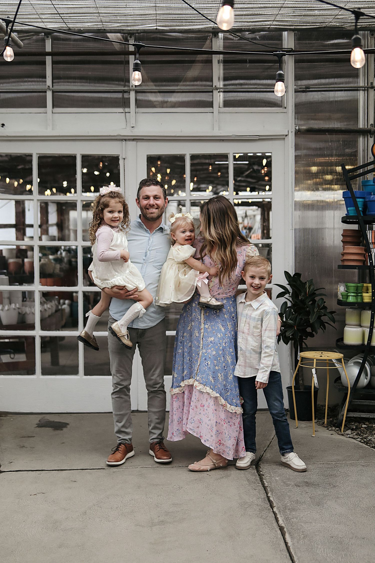 A playful moment captured in a series of four candid photos showing people dancing and enjoying themselves in an industrial space.