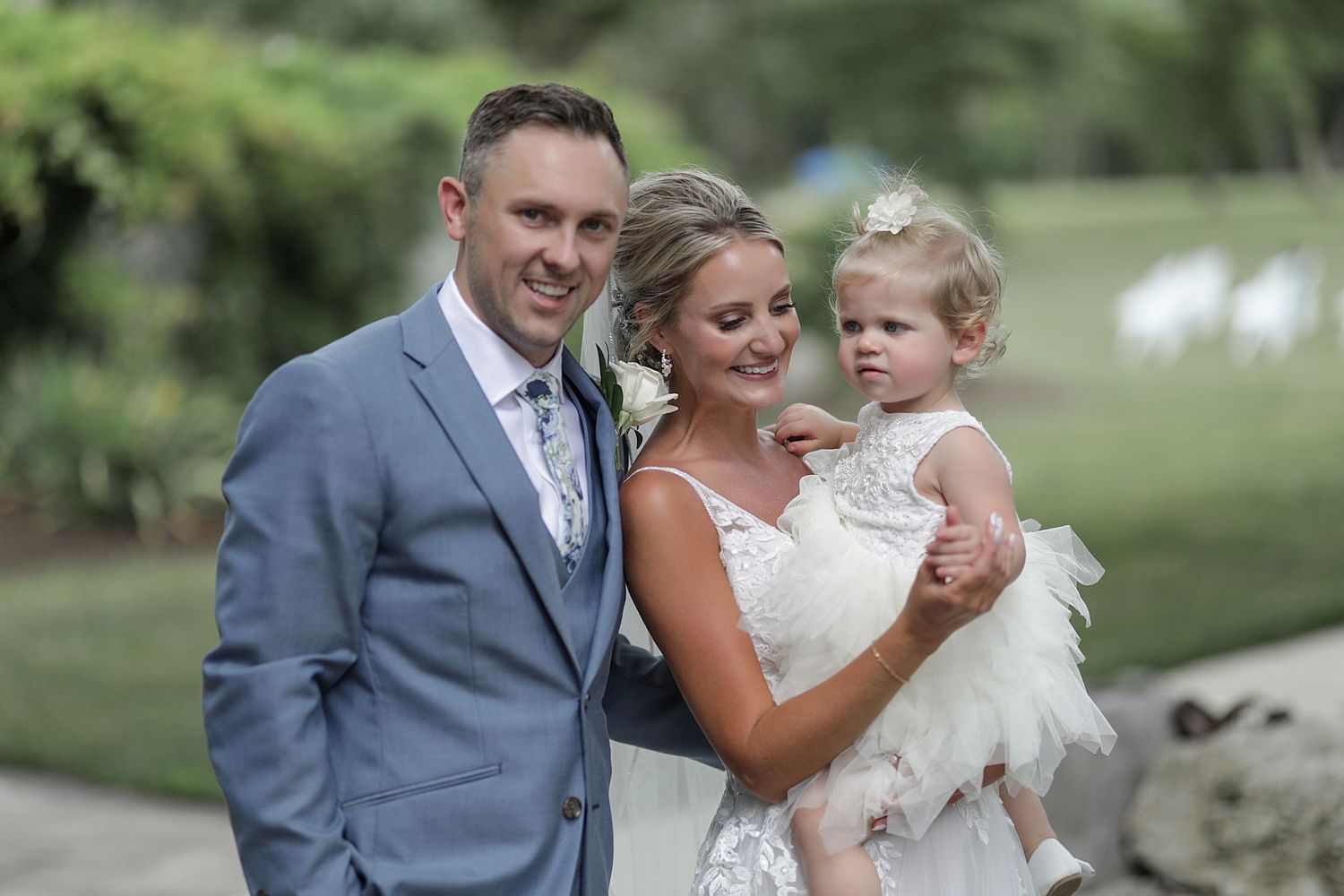 A tender moment captured during an outdoor wedding celebration.