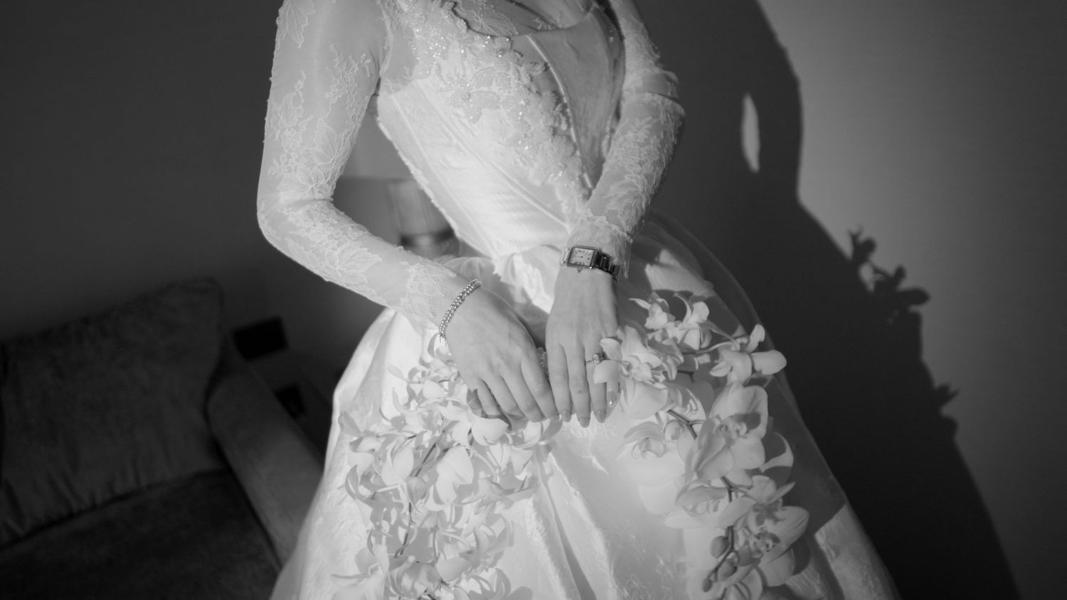 A series of black and white wedding dress detail photos showing lace, beading and fabric textures.