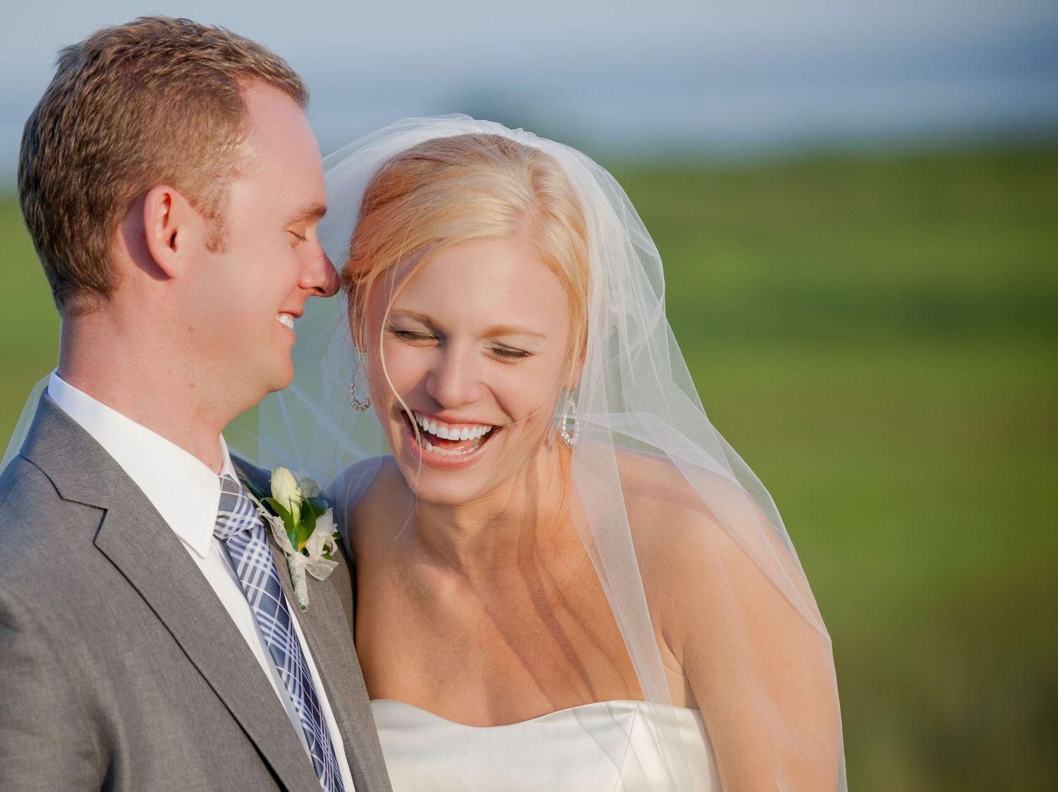 Joyful moment captured during an outdoor wedding celebration.