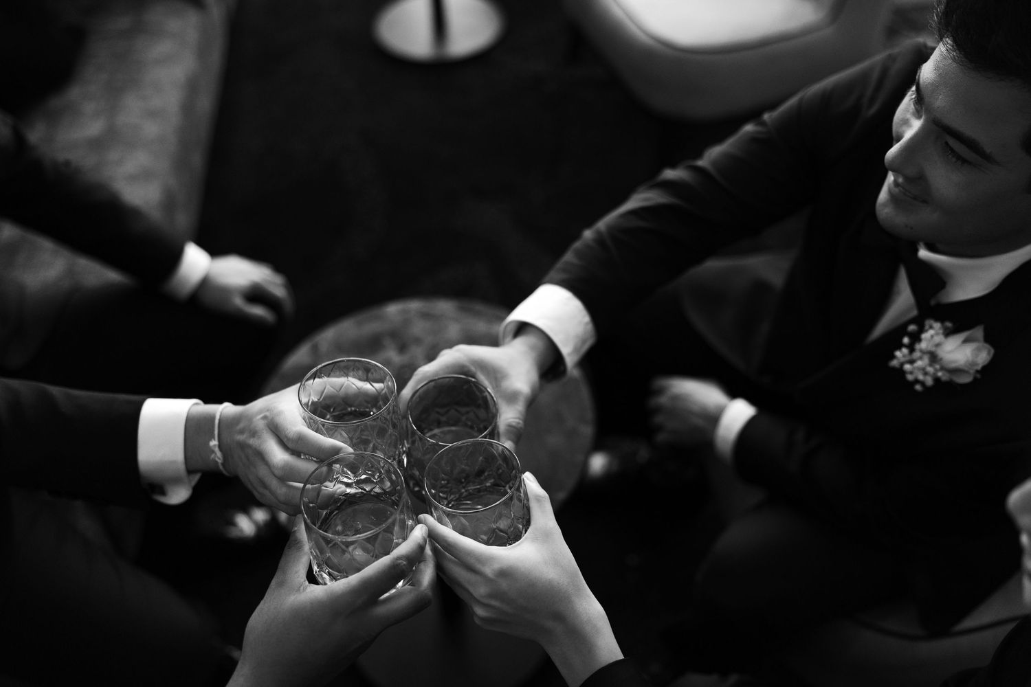 A series of black and white photos showing hands exchanging wedding rings during a marriage ceremony.